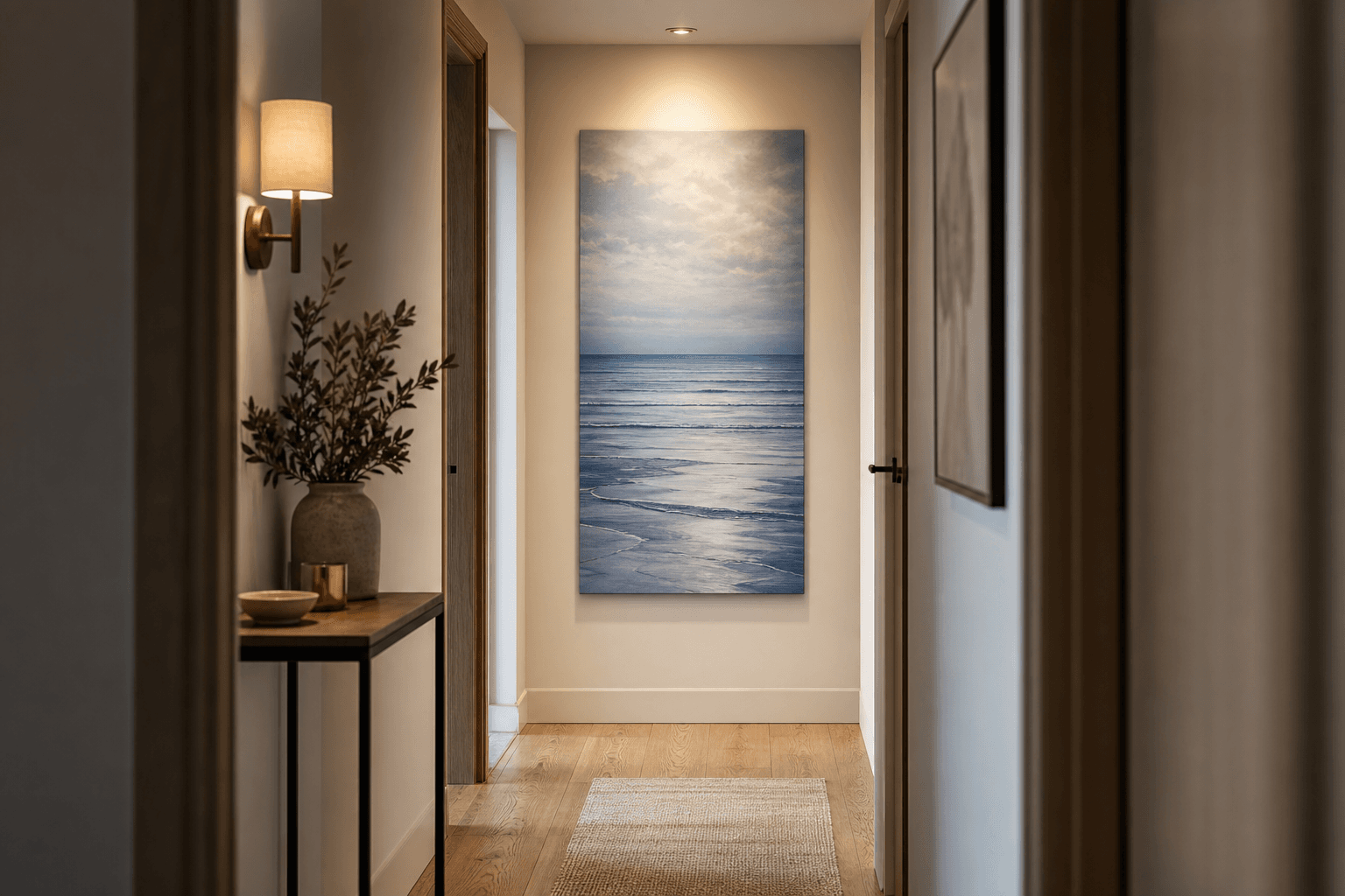 Narrow British hallway with a vertical sea canvas creating a blue sightline at the end of the corridor.