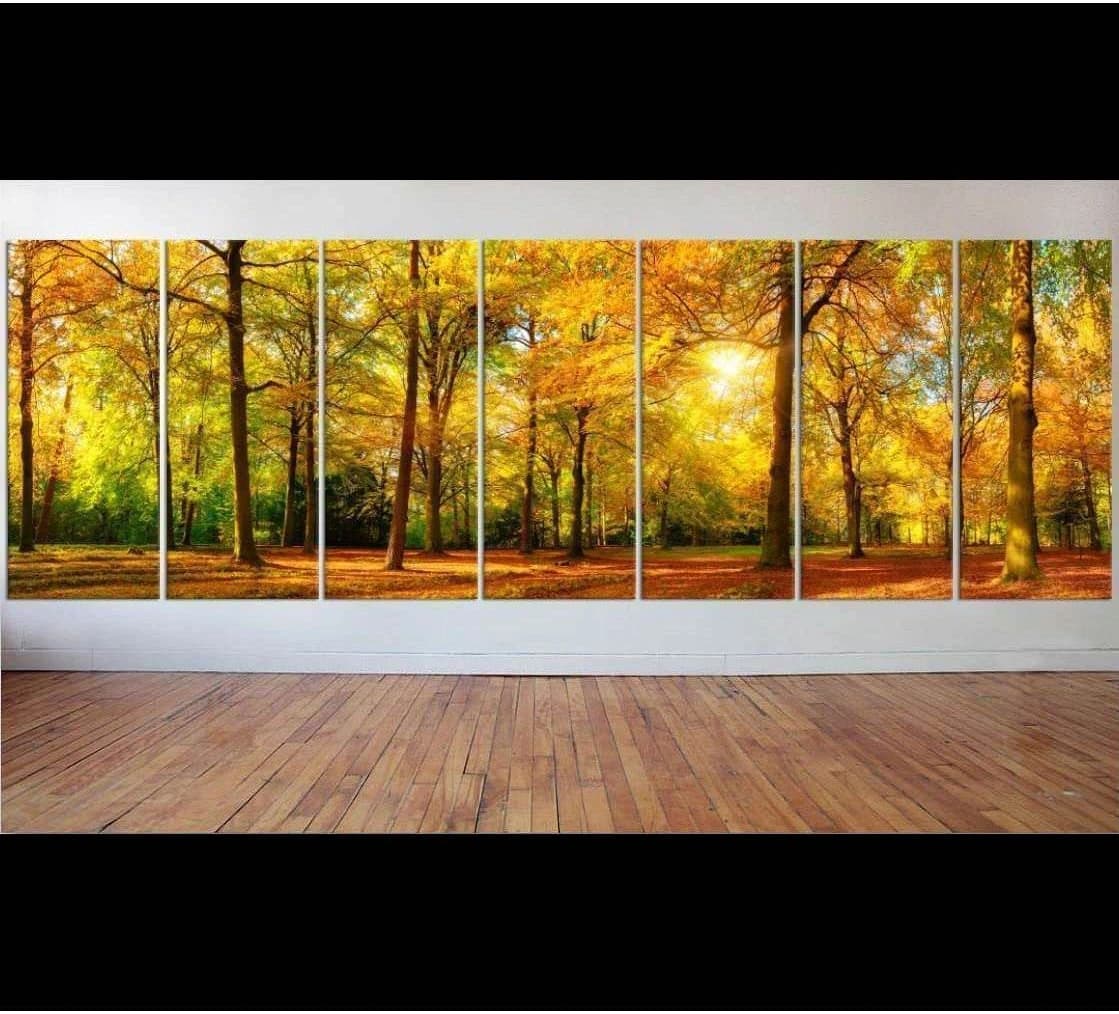 Sunlit autumn forest canvas print with golden fall trees displayed as large multi-panel wall art