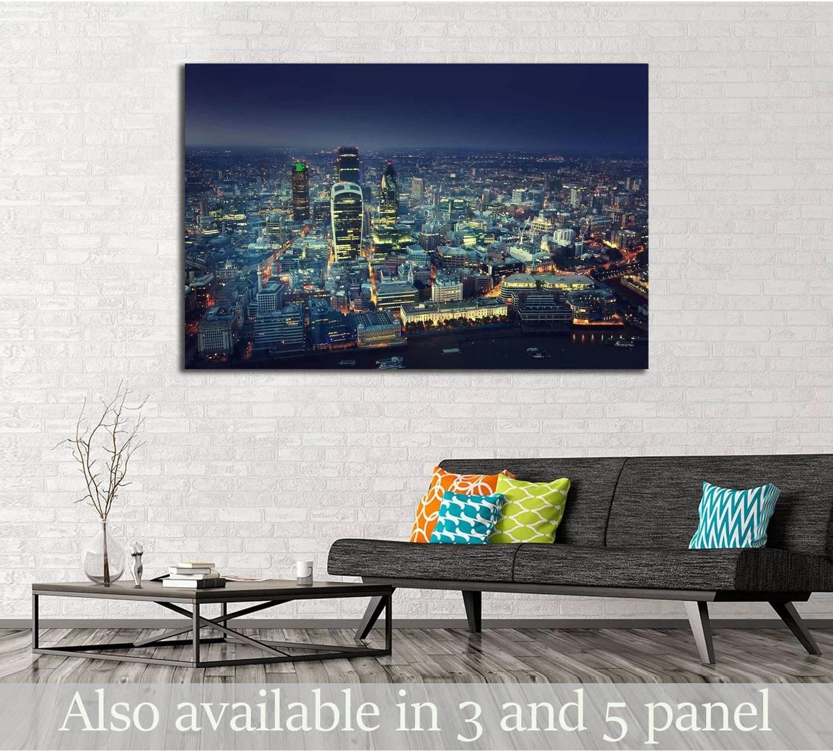City of London skyline canvas print at dusk displayed above a sofa in a modern living room