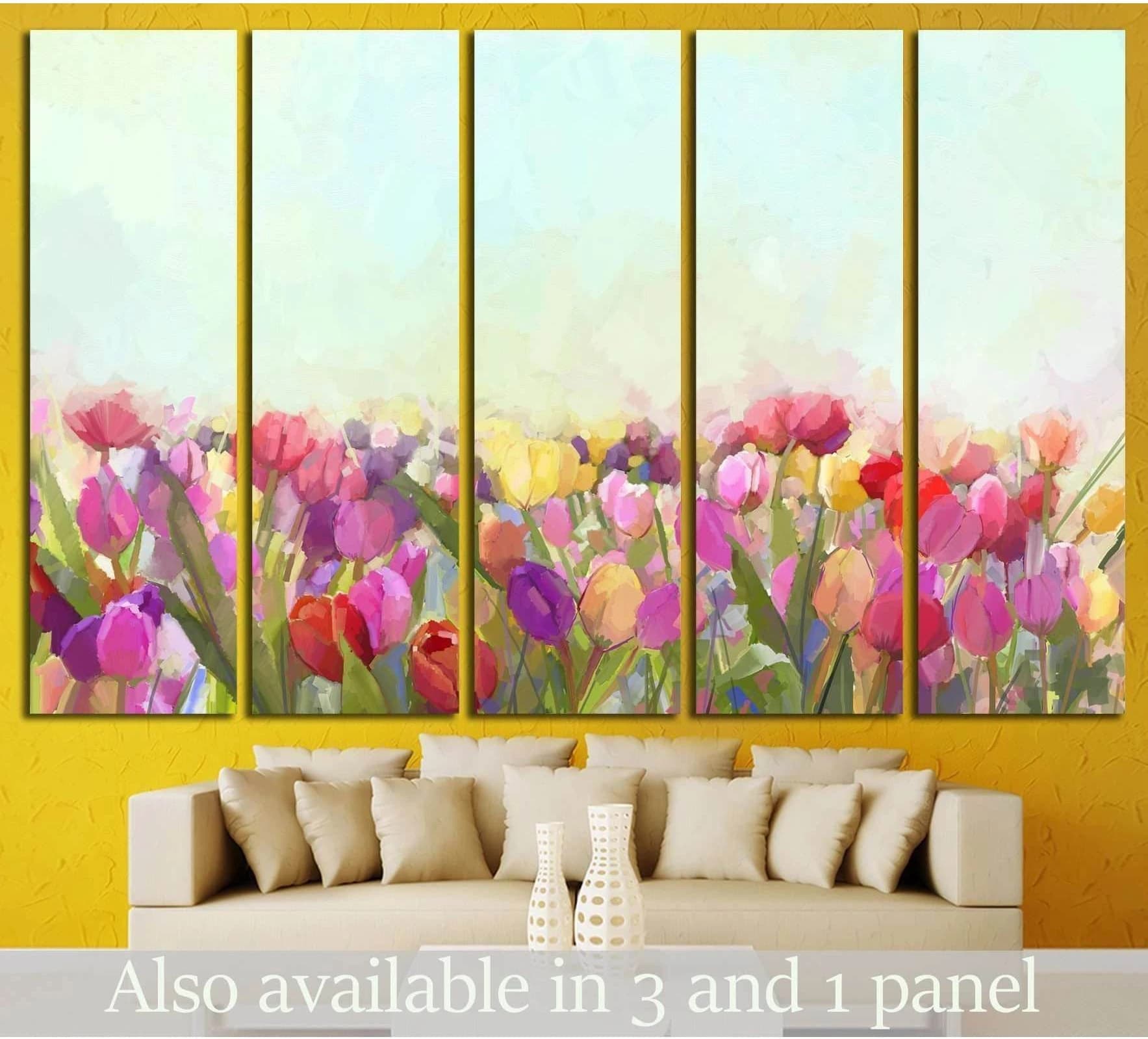 Five-panel tulips canvas print with pink, yellow, and red flowers above a beige sofa on a yellow wall