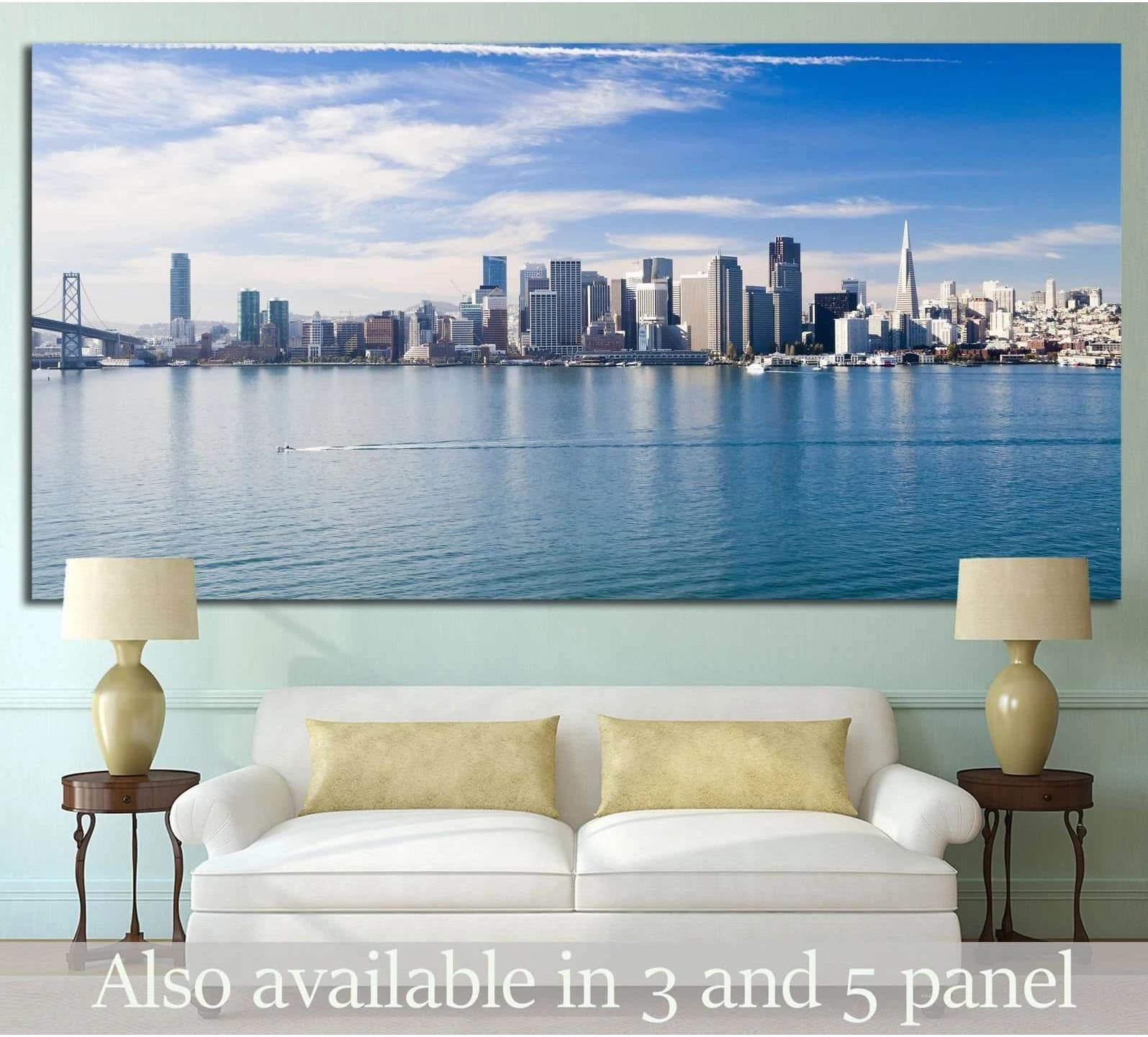 Panoramic San Francisco skyline canvas print with Bay Bridge above sofa in a modern living room