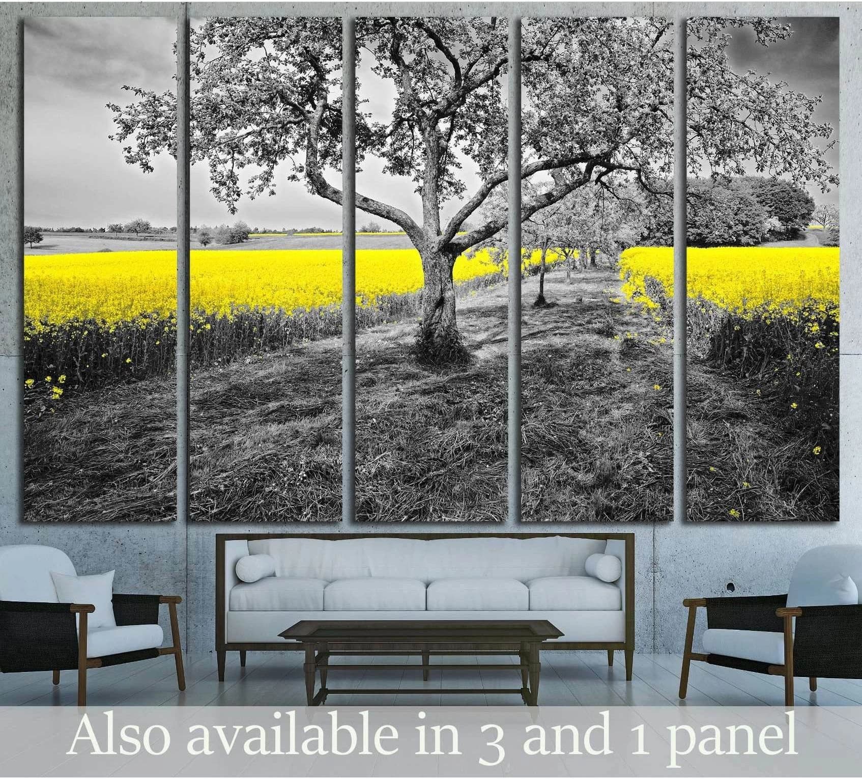 Five-panel yellow rapeseed field canvas print with tree above sofa in modern living room