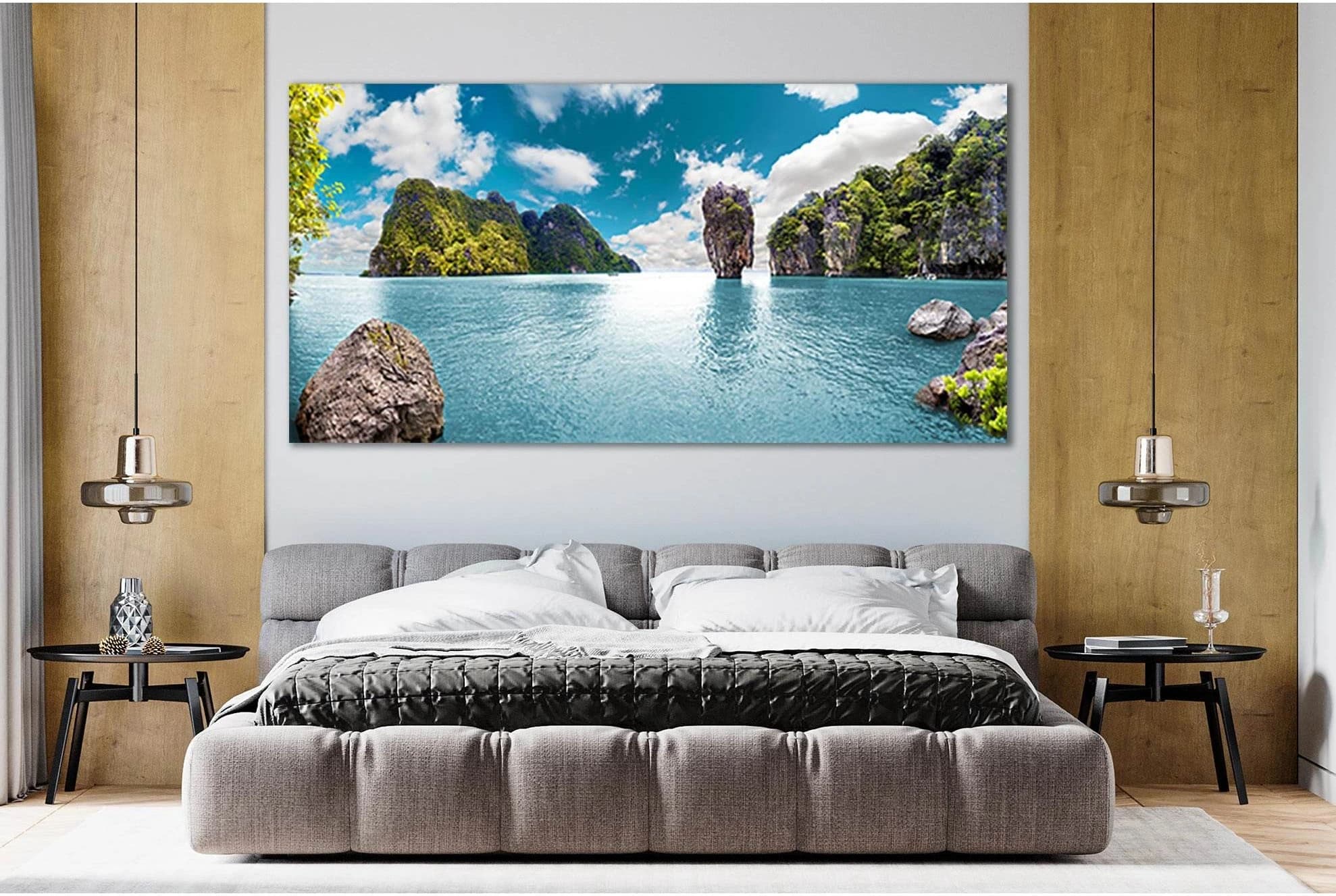 Turquoise ocean seascape with green islands, rocky cliffs and white clouds under a blue sky detail view