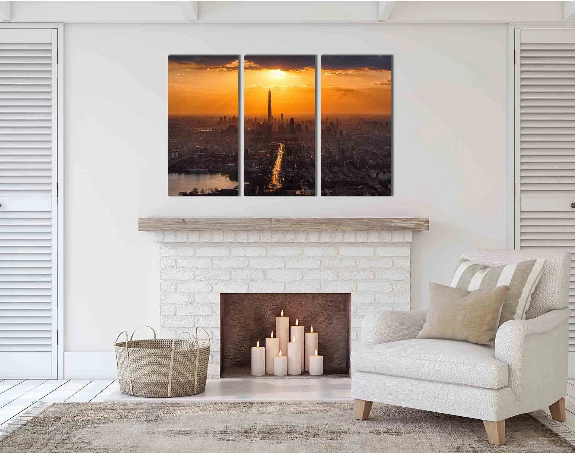 Sunset city skyline with a tall tower, glowing golden sun, and river reflections at dusk detail view