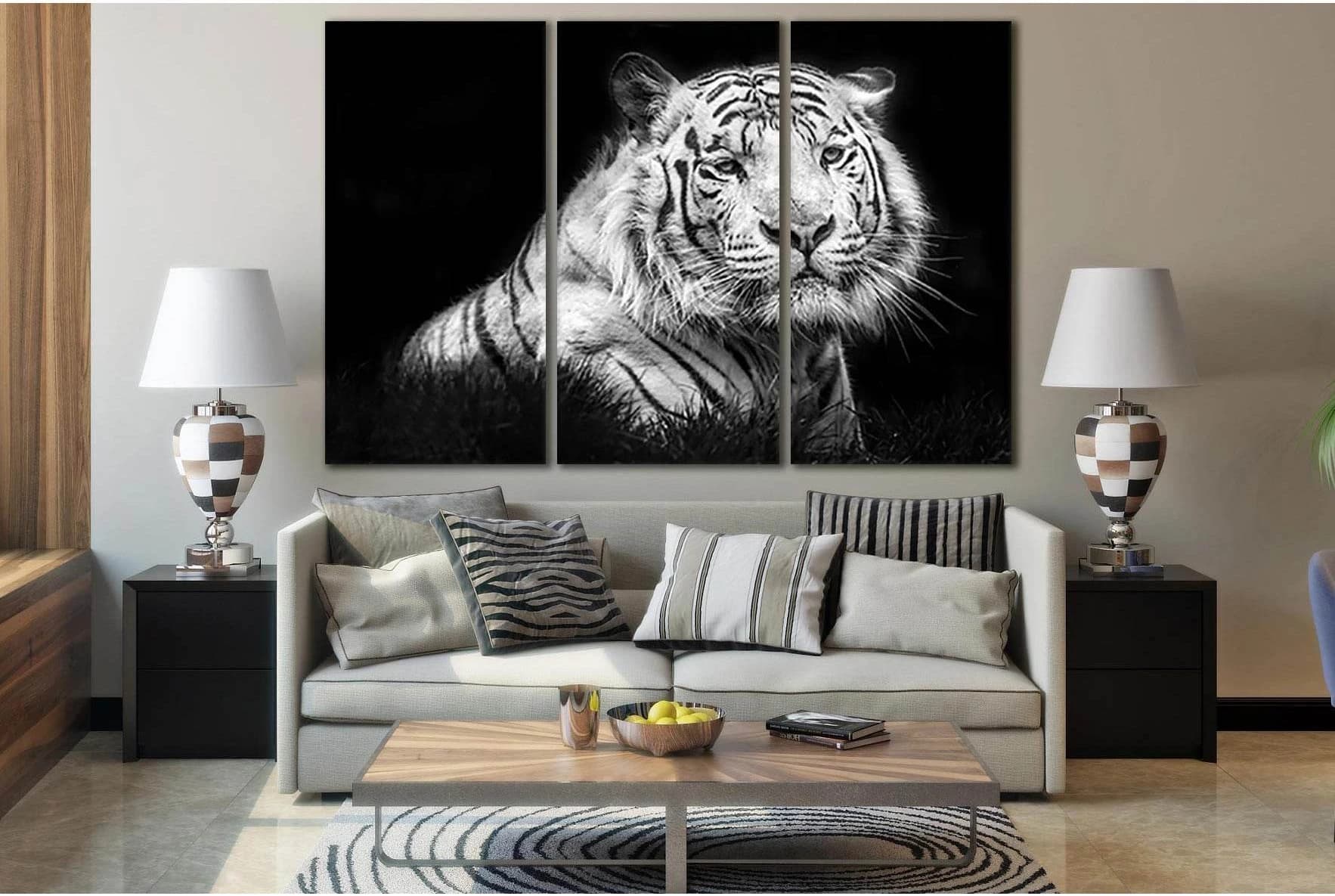 Black and white tiger face split across three vertical panels with sharp eyes and stripes