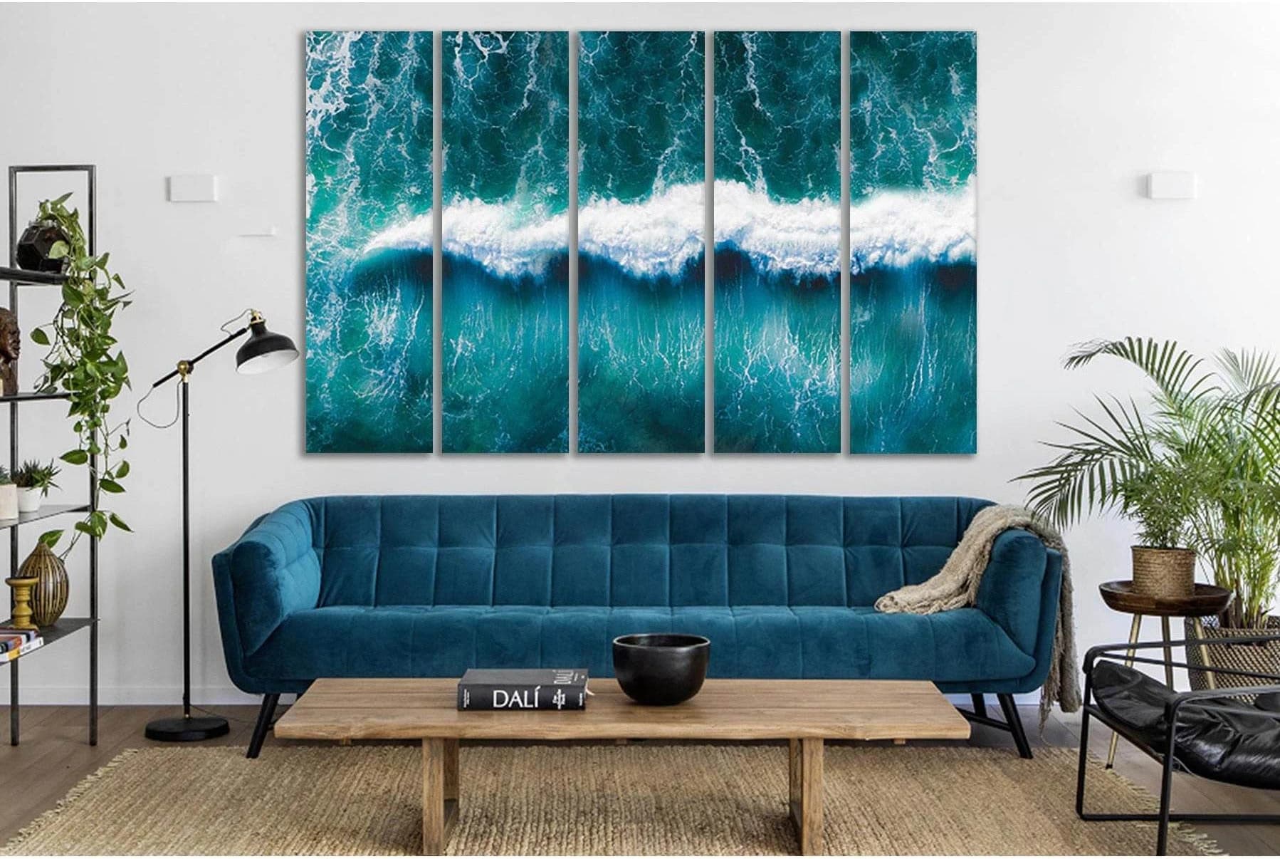 Teal ocean wave artwork with bright white foam breaking across the centre detail view