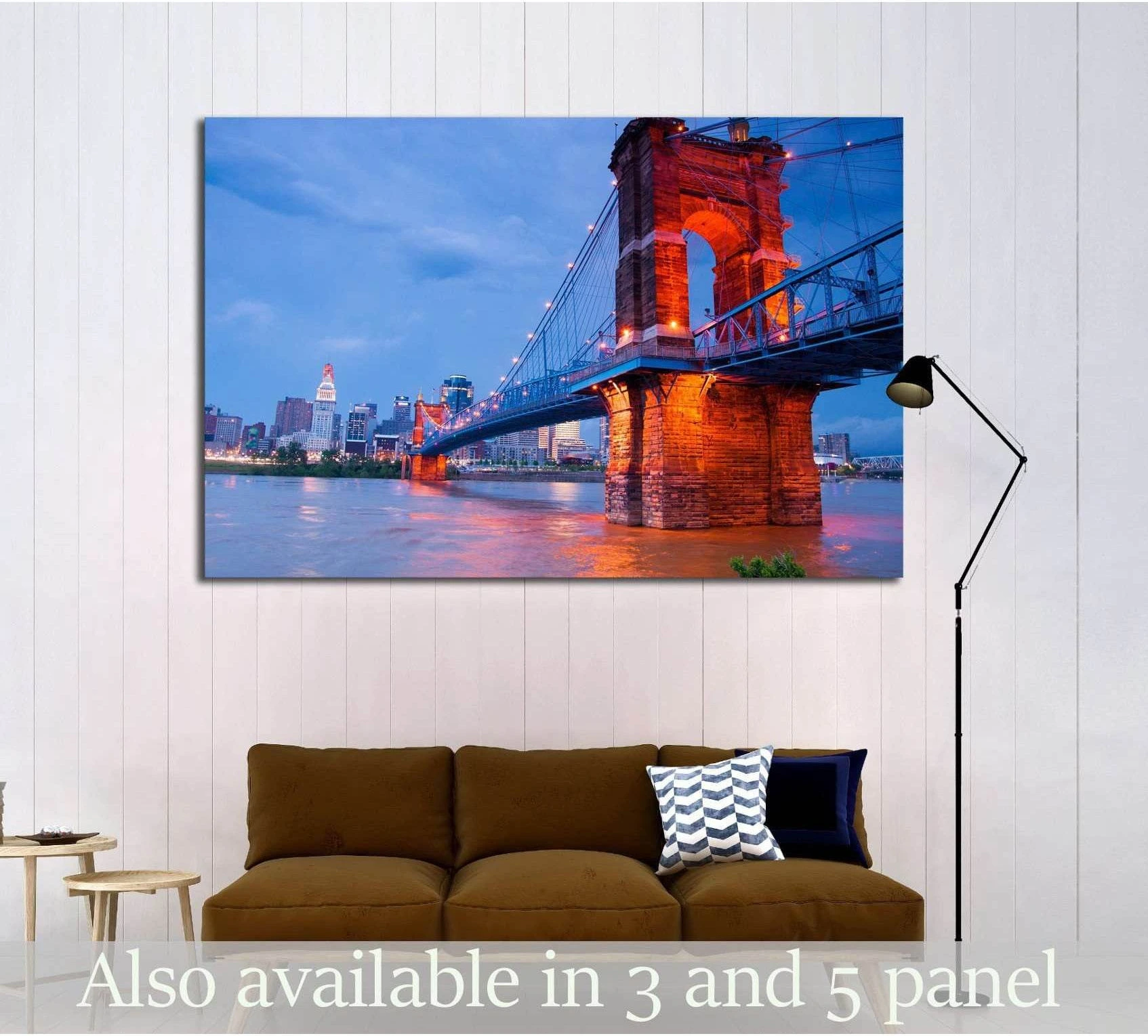 Cincinnati bridge canvas print with lit suspension bridge at dusk above sofa in modern living room