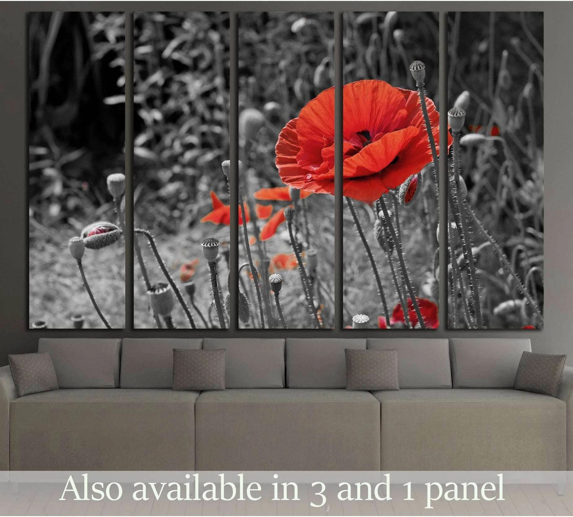 Red poppy canvas print on black and white floral background hung above sofa in modern living room