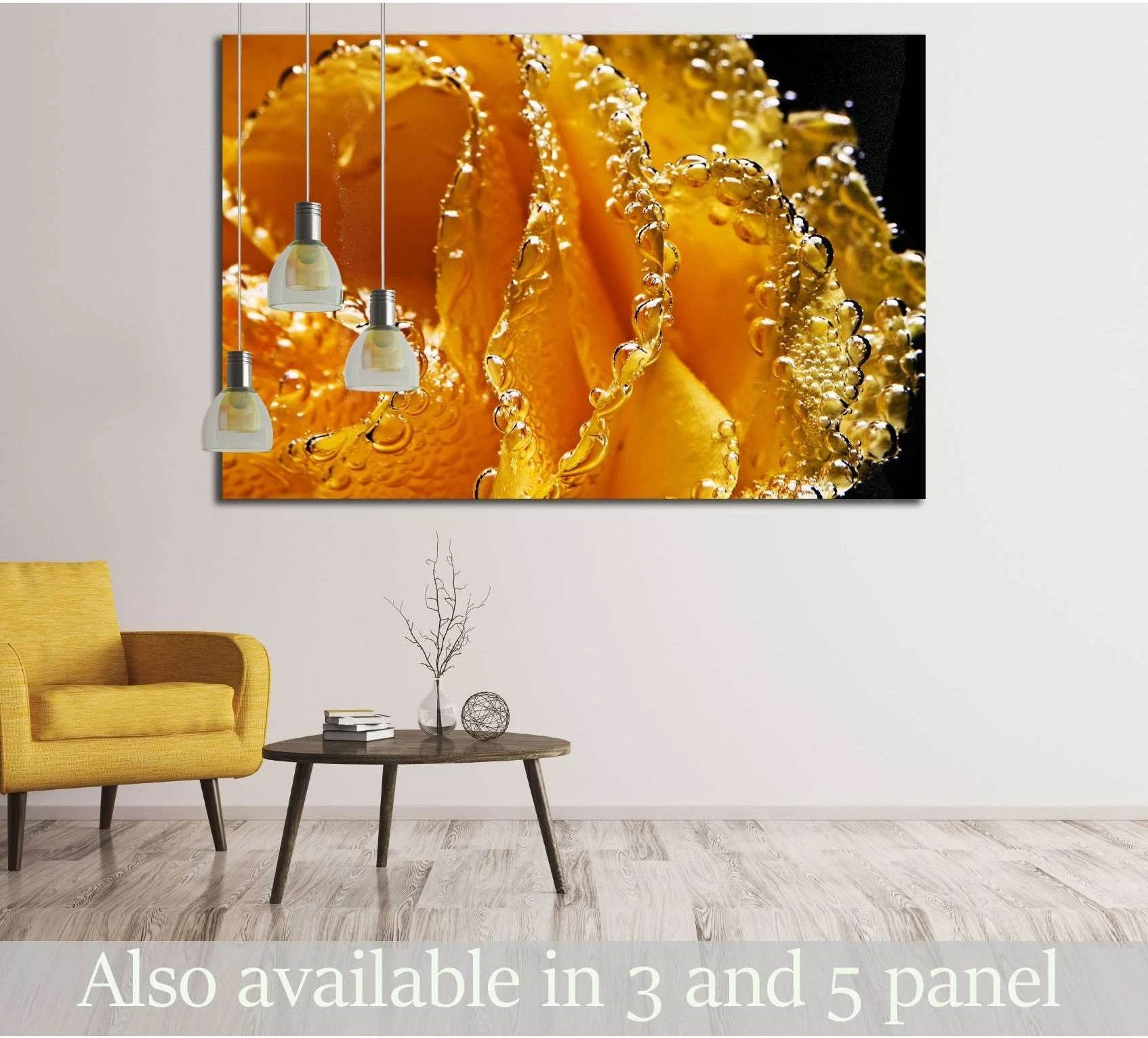 Yellow rose canvas print with golden petals and underwater bubbles above a sofa in a modern living room