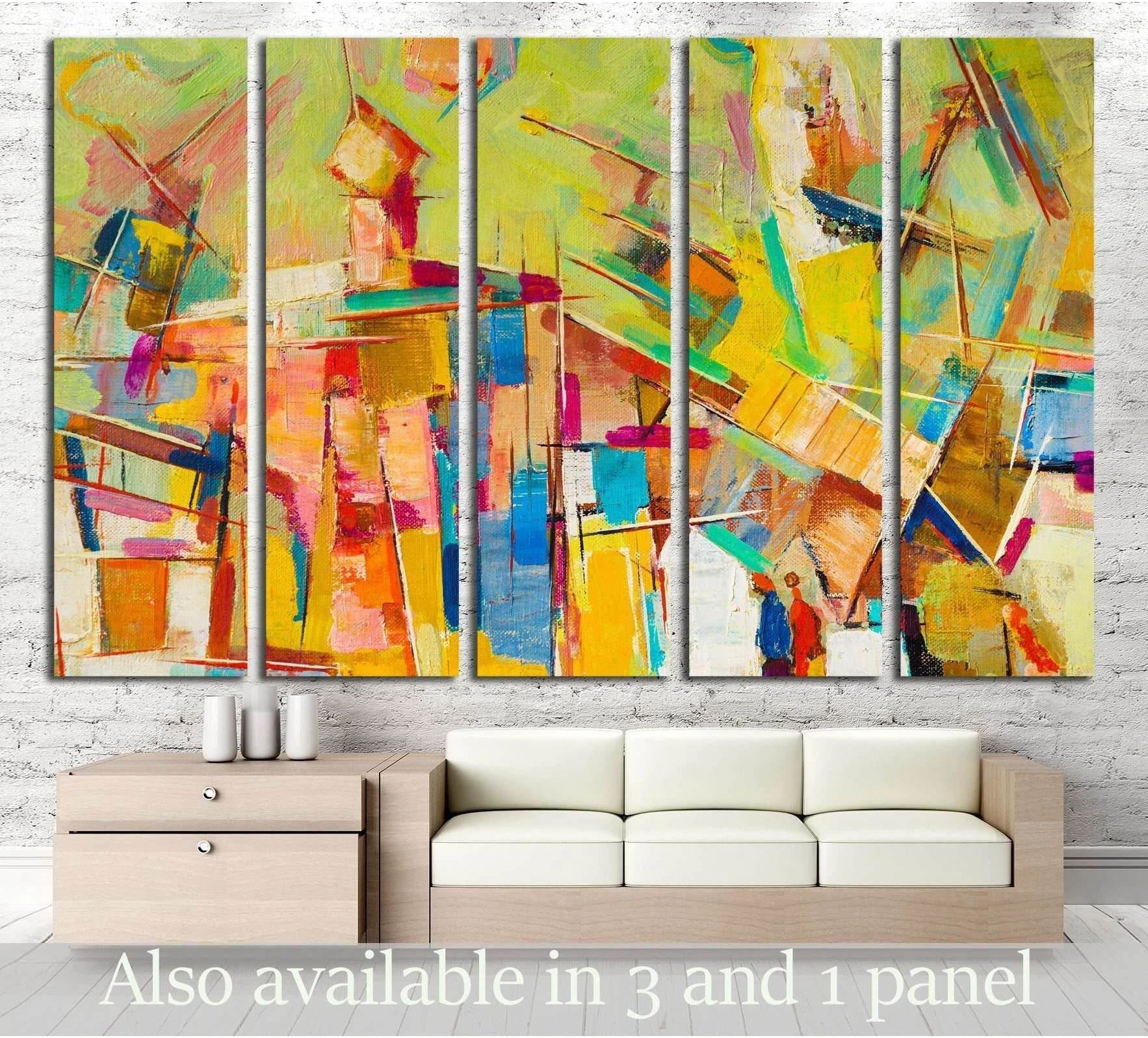 Colorful abstract canvas print with yellow, coral, teal, and blue brushstrokes above sofa