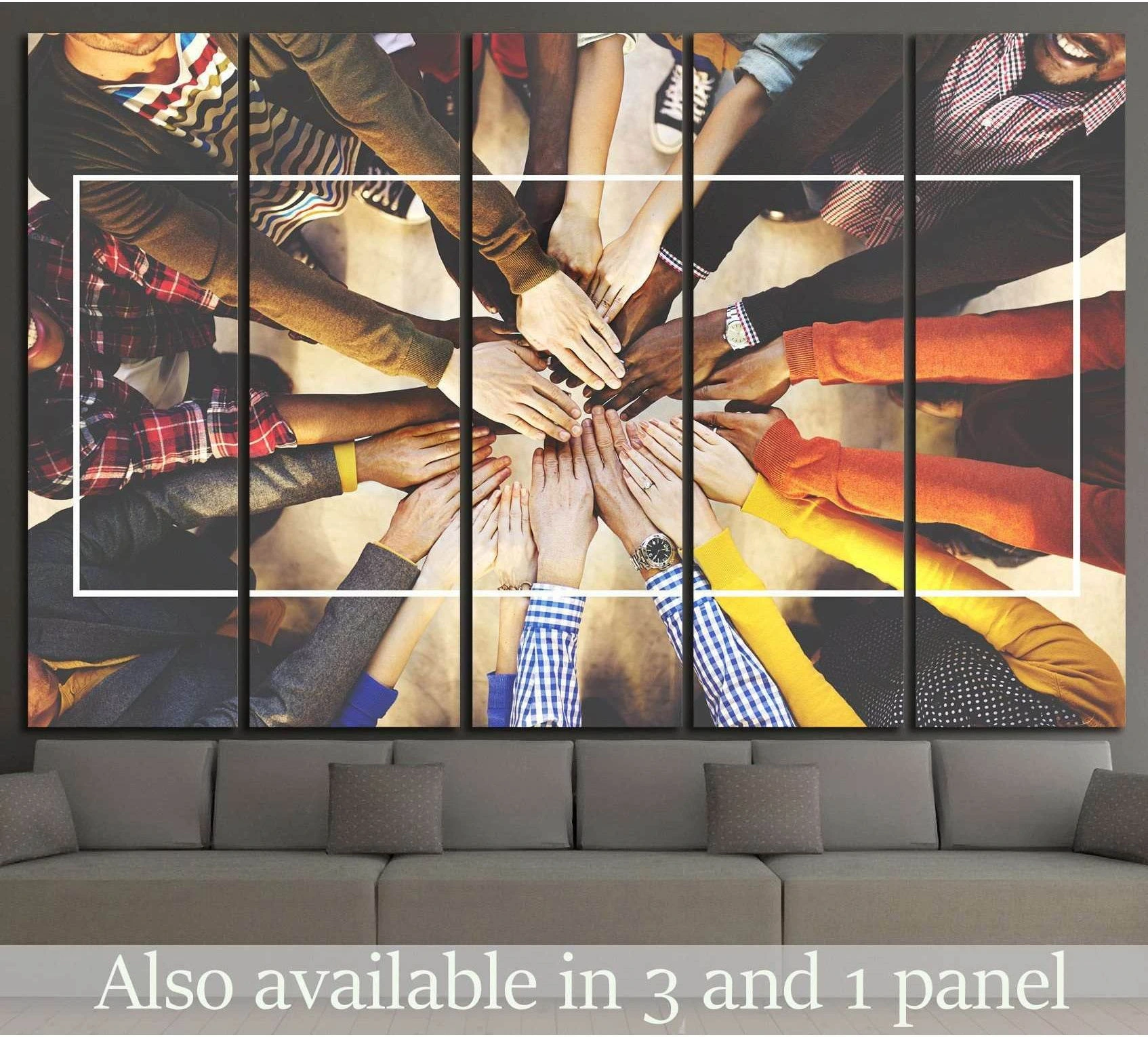 Diverse hands joined in a circle teamwork canvas print above a sofa in a modern office