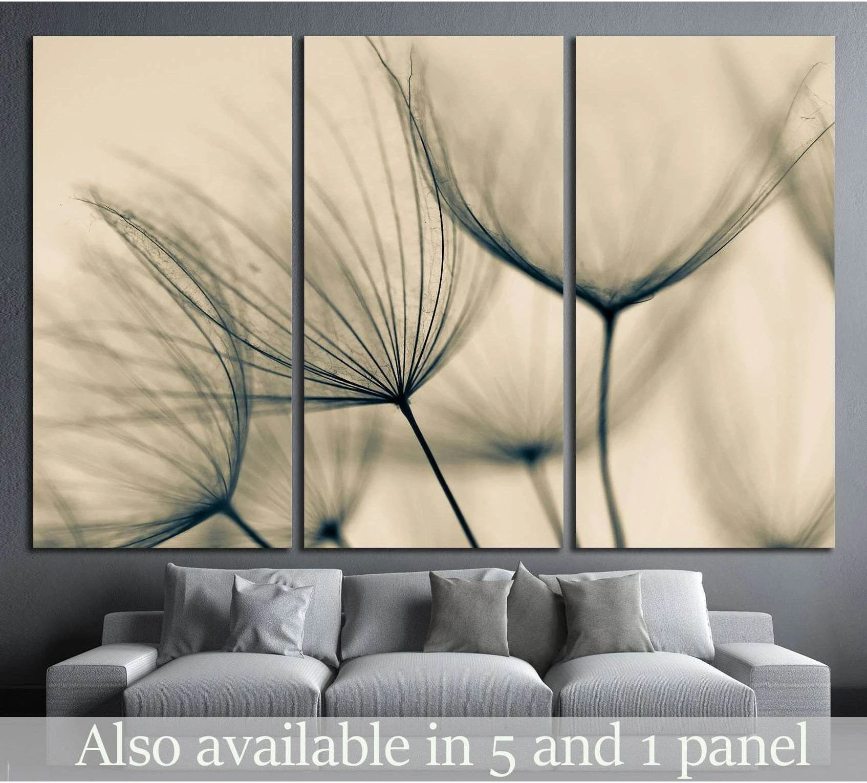 Sepia dandelion triptych canvas print above a gray sofa in a modern minimalist living room