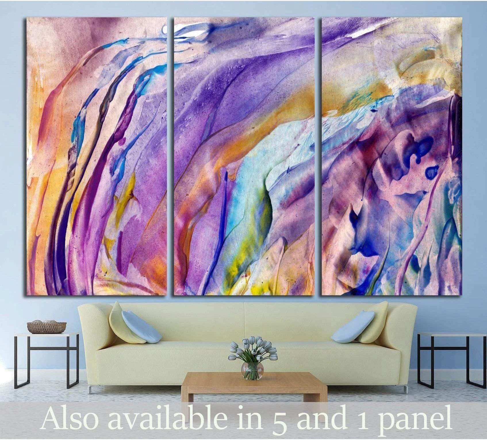 Triptych abstract floral canvas print in lavender, aqua, and gold above a sofa in a modern living room