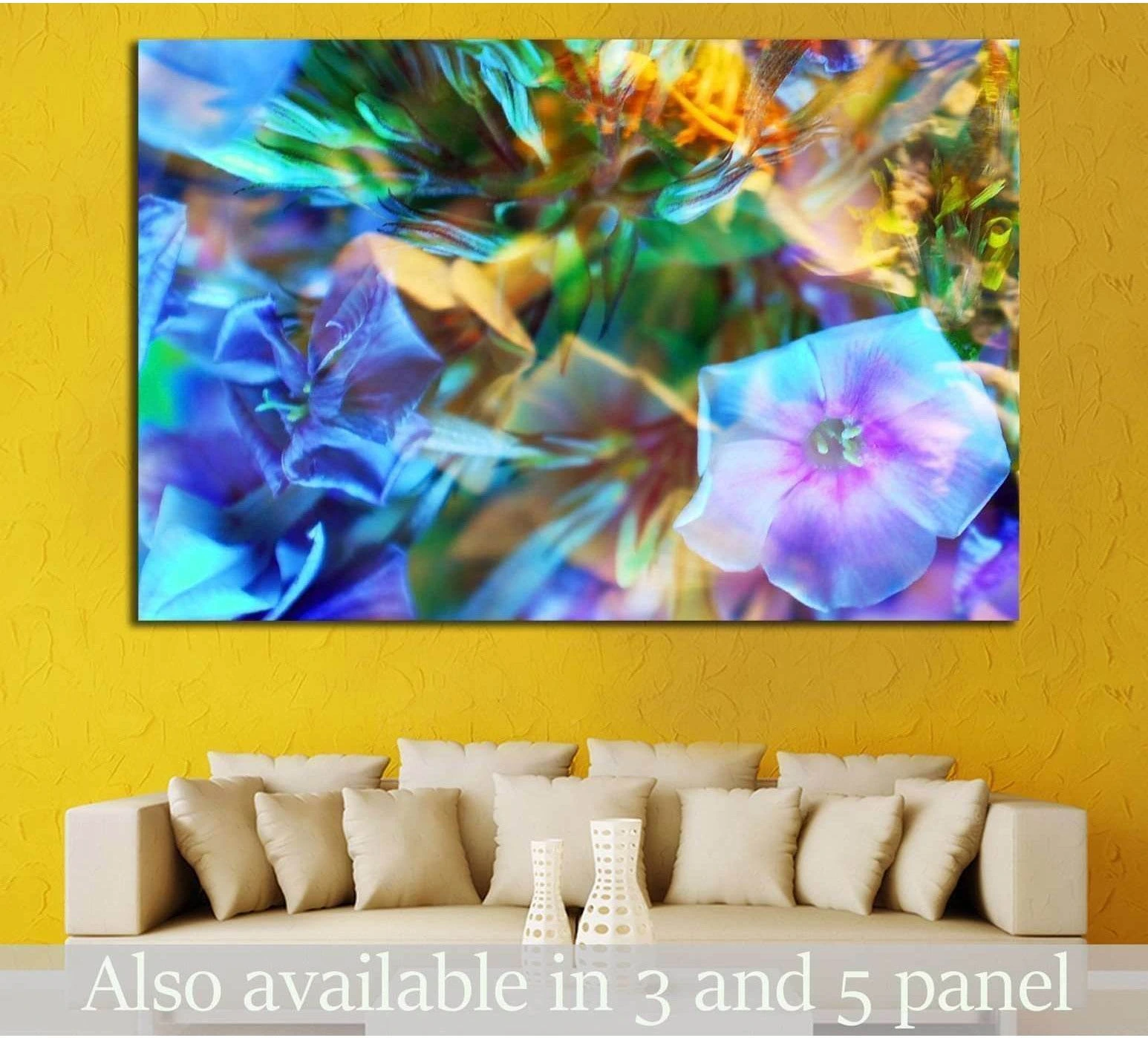 Abstract floral canvas print with blue, purple, teal, and green petals hung above a sofa
