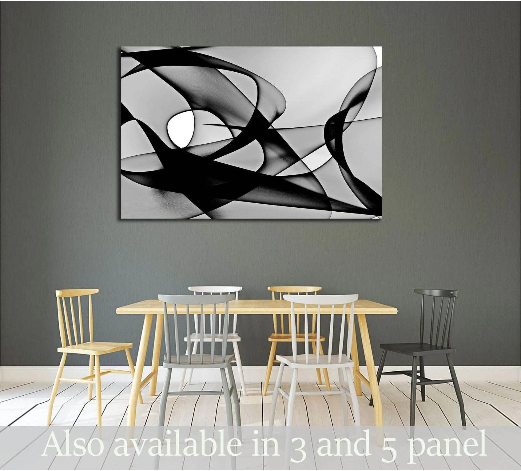 Black and white abstract canvas print with flowing ribbon shapes above a dining table in a modern room