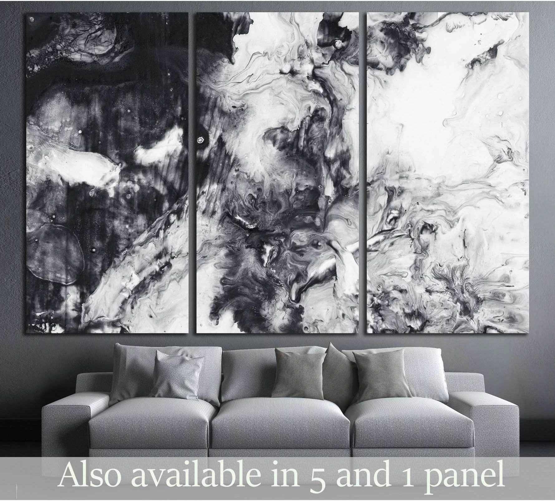 Black and white abstract triptych canvas print with fluid marble swirls above a gray sofa