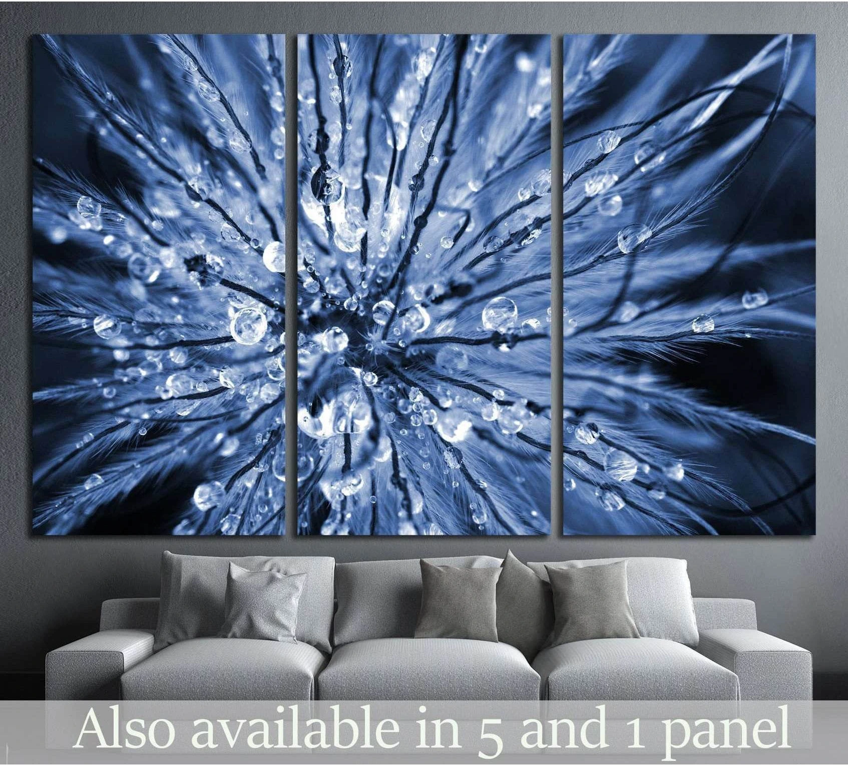 Blue dewdrops abstract macro canvas print hung above a sofa in a modern living room