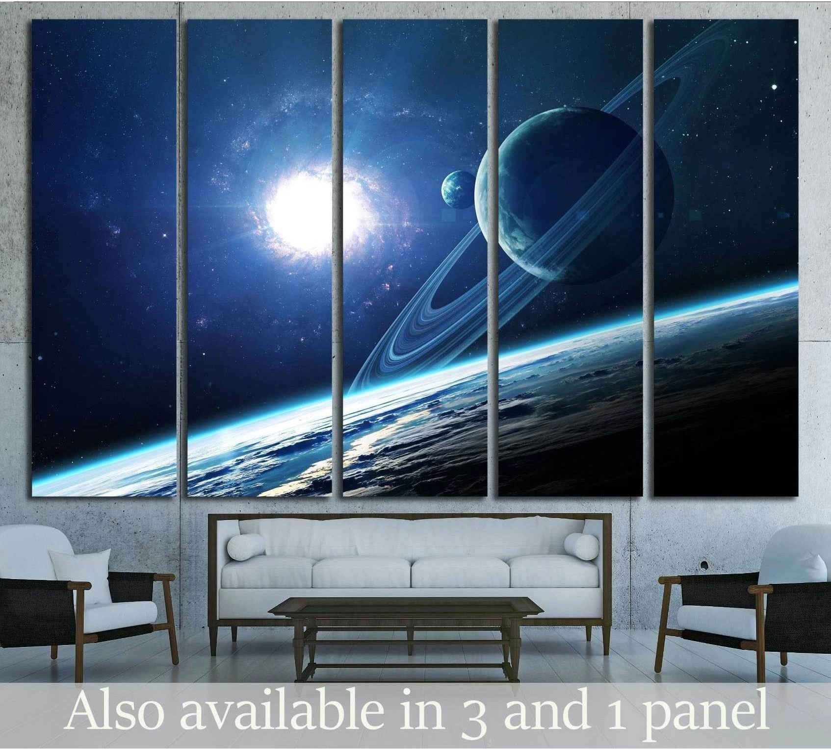 Ringed planet canvas print with blue nebula, stars, and space horizon hung above a sofa in a modern living room