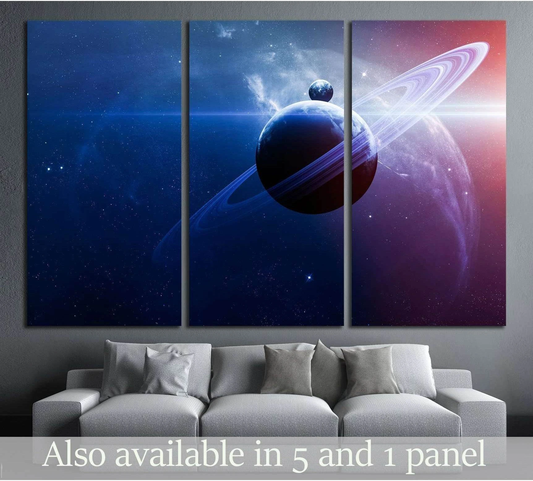 Triptych ringed planet canvas print with blue nebula and stars above sofa in modern living room