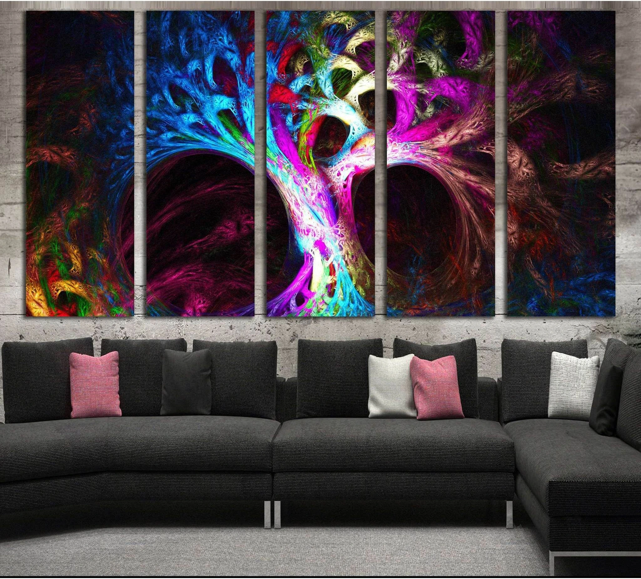 Abstract neon tree canvas print with glowing blue, pink, and purple branches above a gray sofa