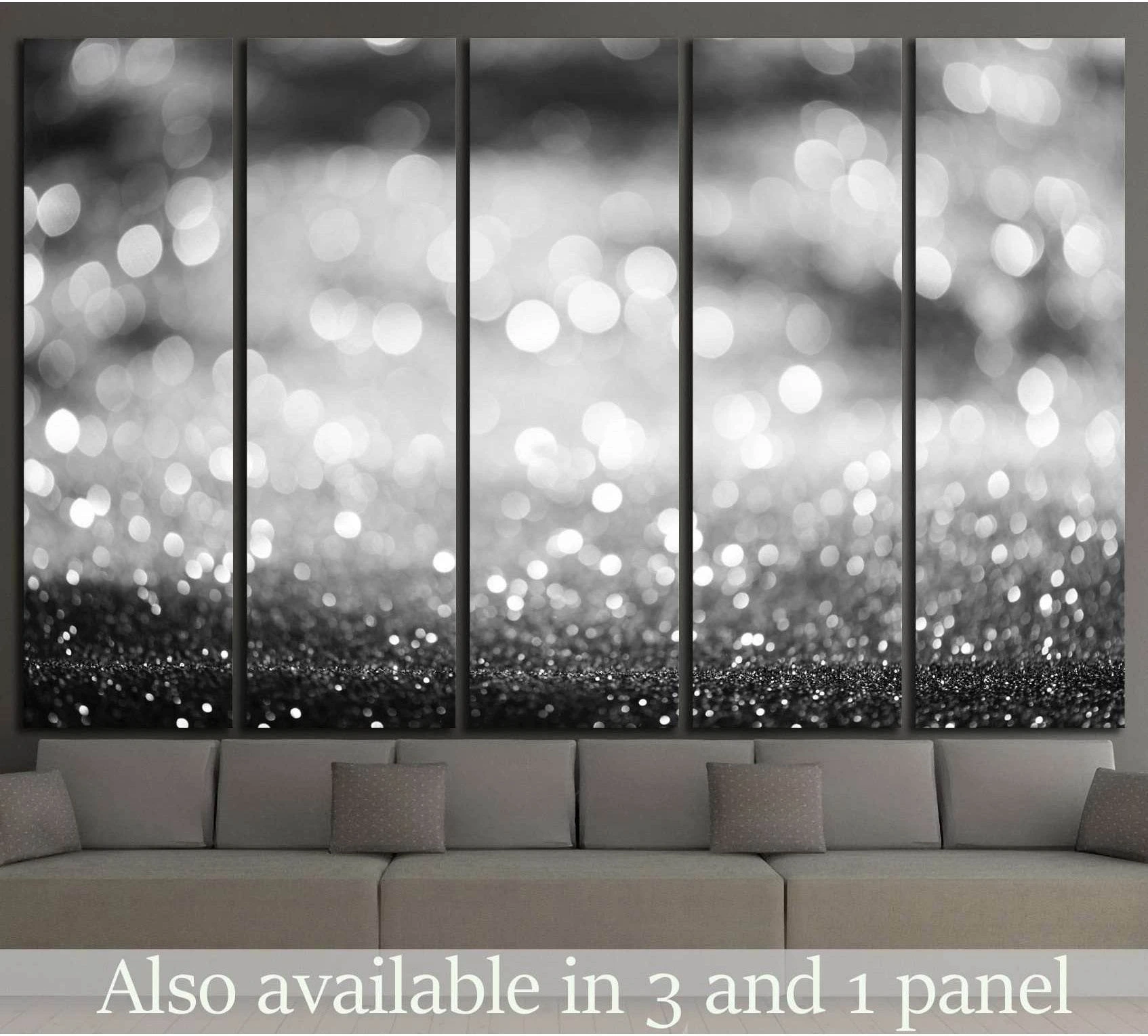 Black and white bokeh canvas print in a five-panel layout above a sofa in a modern living room