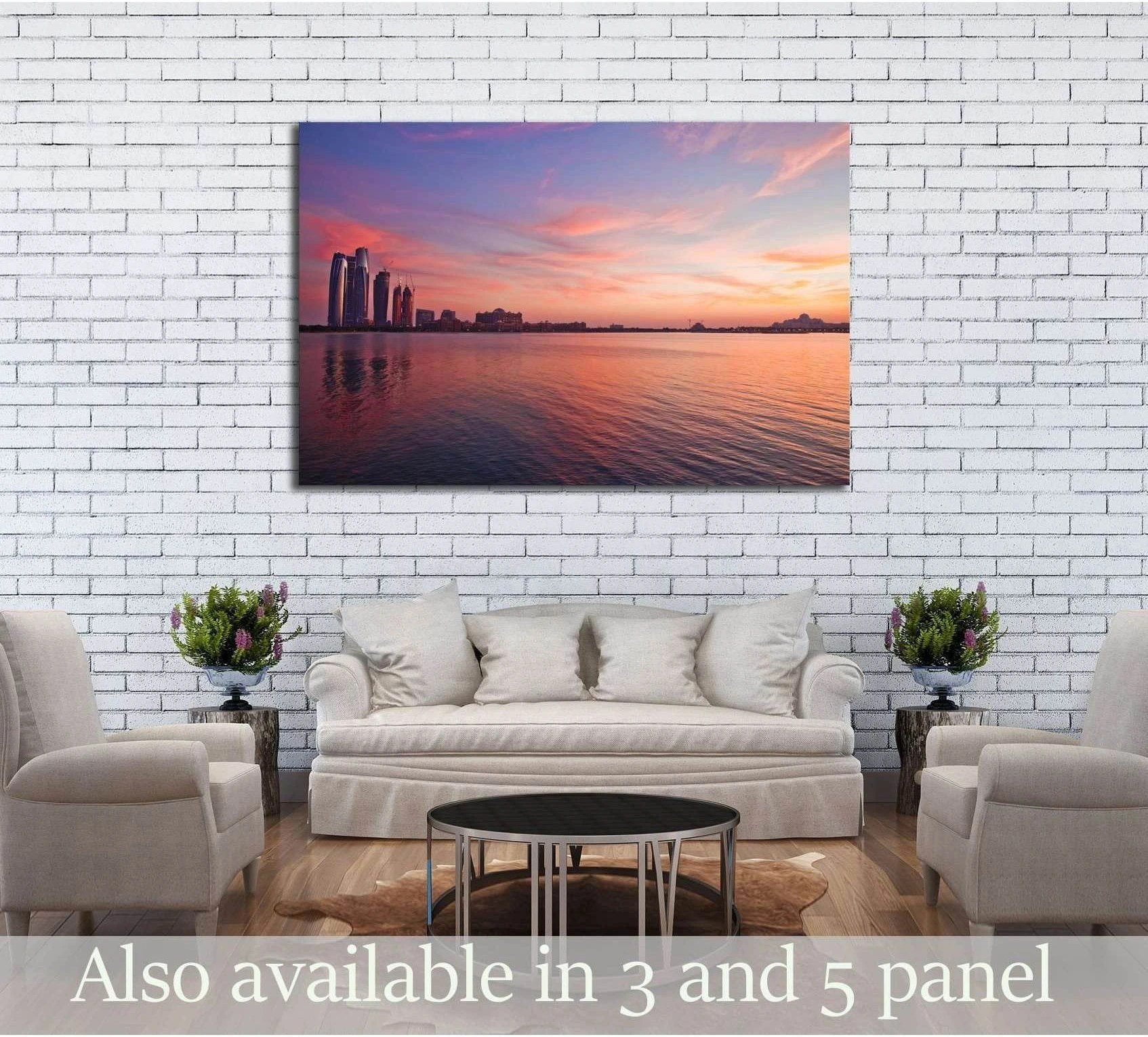 Abu Dhabi skyline sunset canvas print hung above a sofa in a neutral living room
