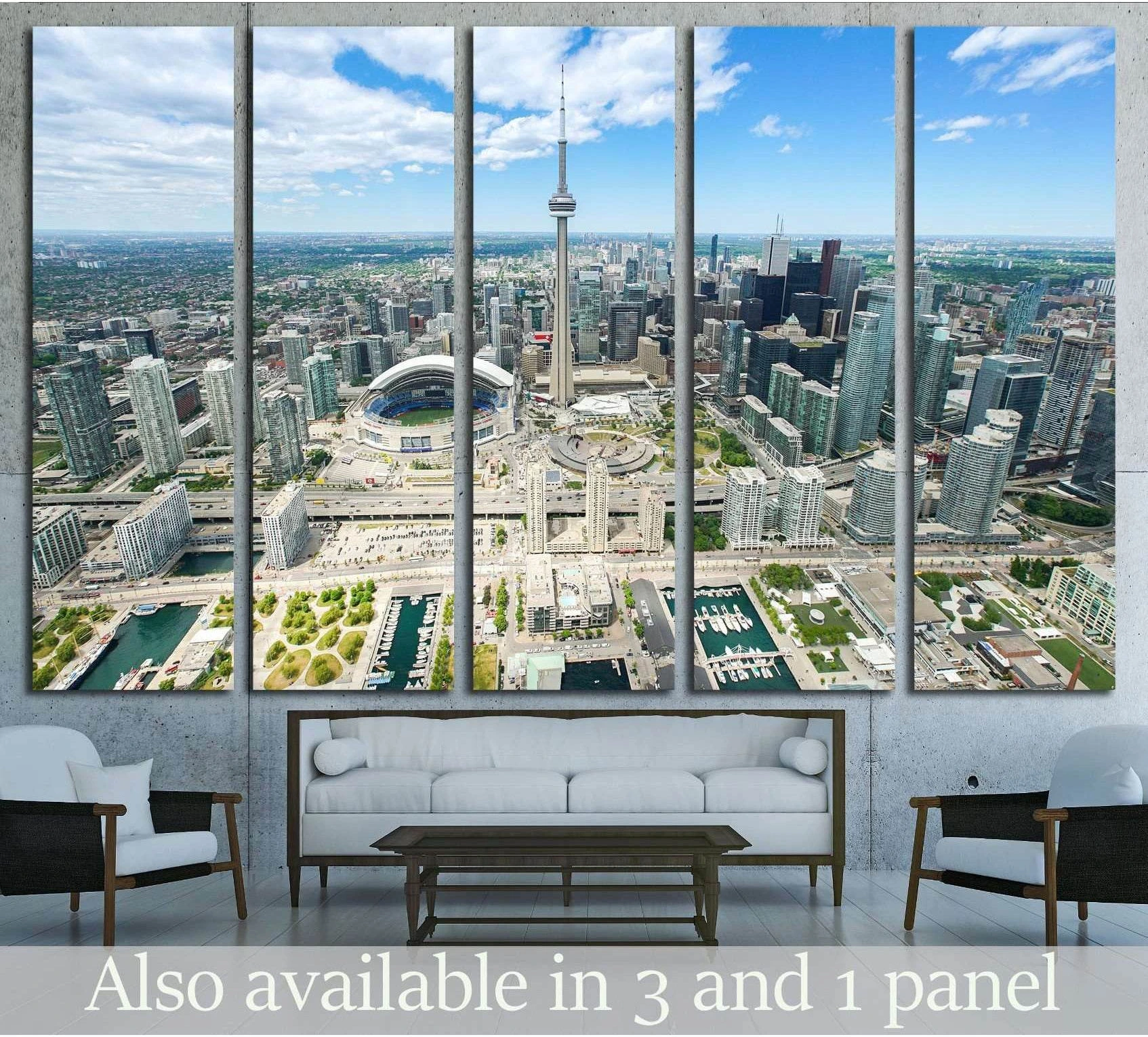 Toronto aerial skyline canvas print with CN Tower and Rogers Centre above sofa in modern living room