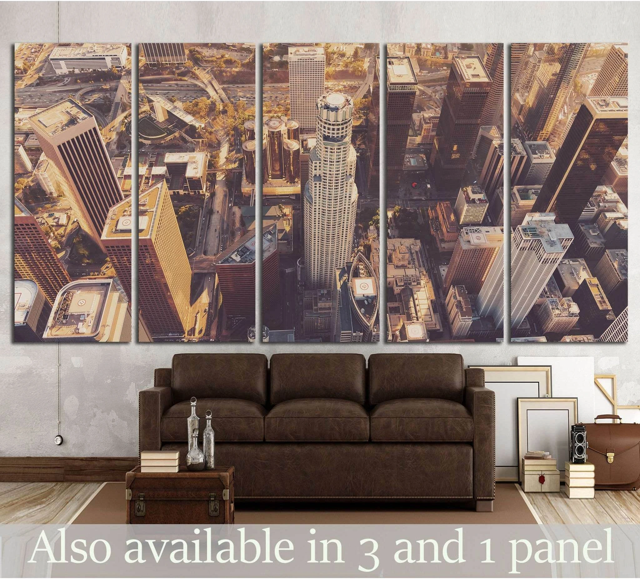 Downtown Los Angeles aerial skyline canvas print at sunset displayed above a sofa in a modern loft
