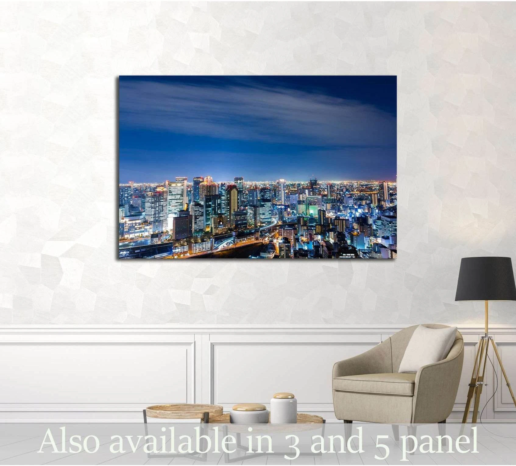 Osaka night skyline canvas print with glowing city lights displayed in a modern living room