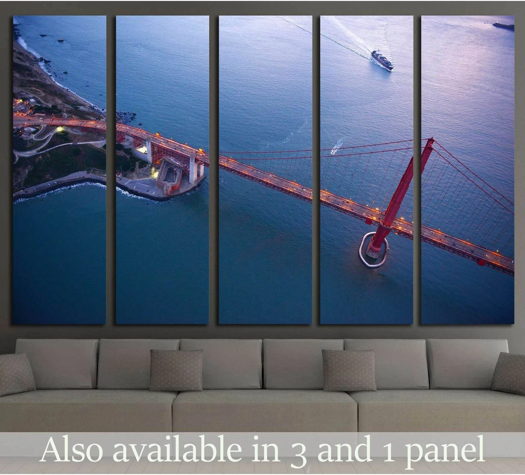 Aerial Golden Gate Bridge canvas print above a sofa in a modern living room at blue hour