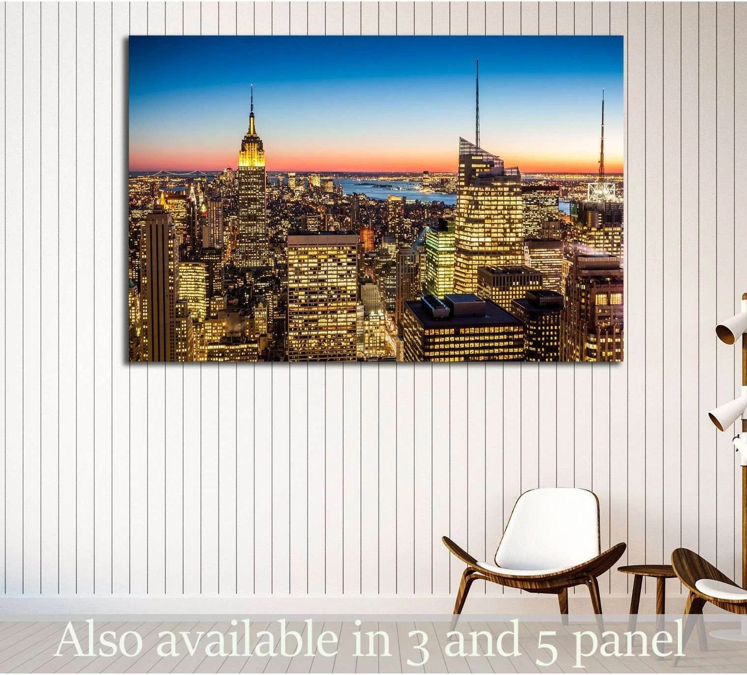 New York City skyline canvas print with Empire State Building at dusk, displayed in a modern room