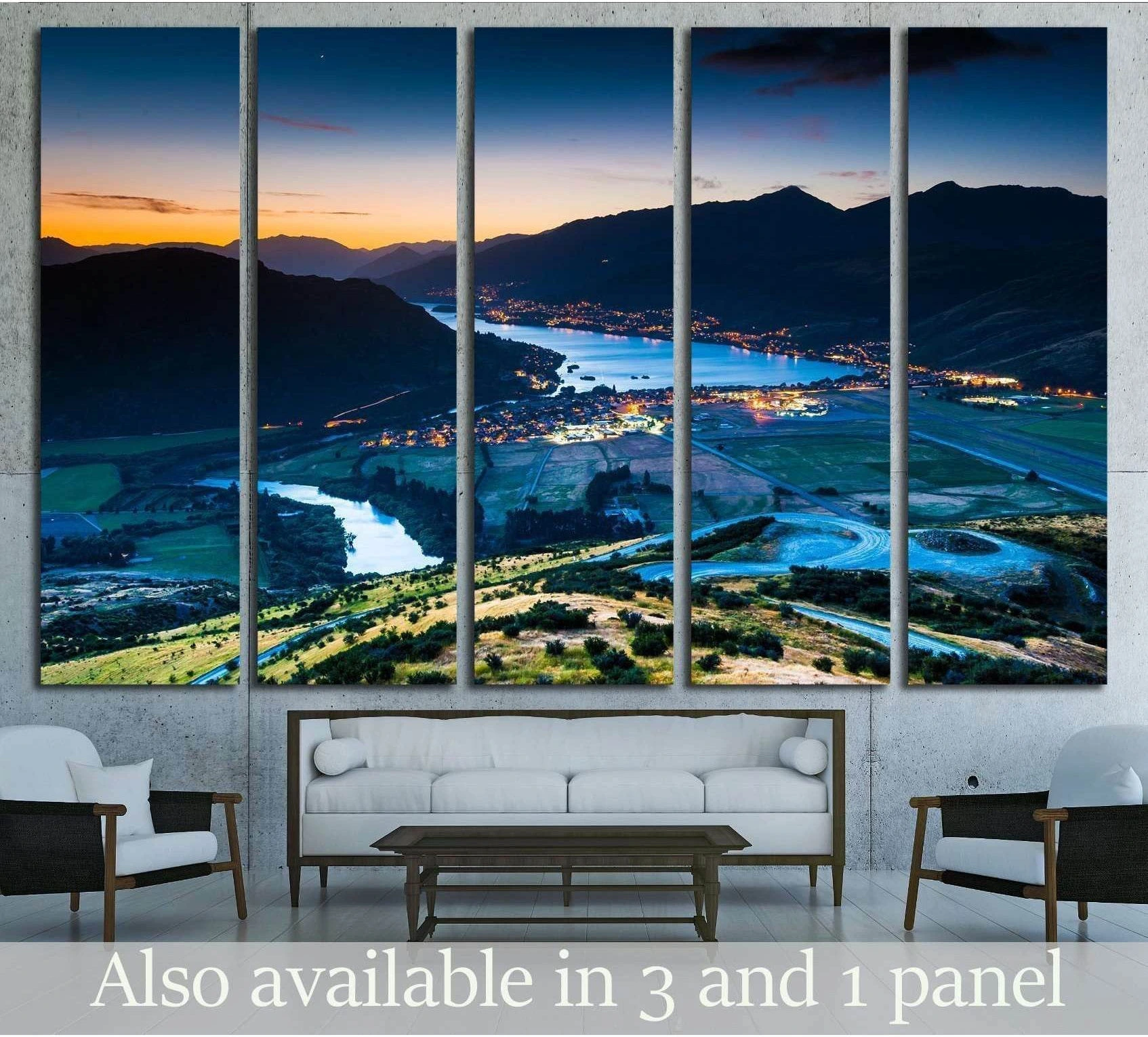 Queenstown aerial canvas print over Lake Wakatipu at dusk, displayed above a sofa in a modern living room