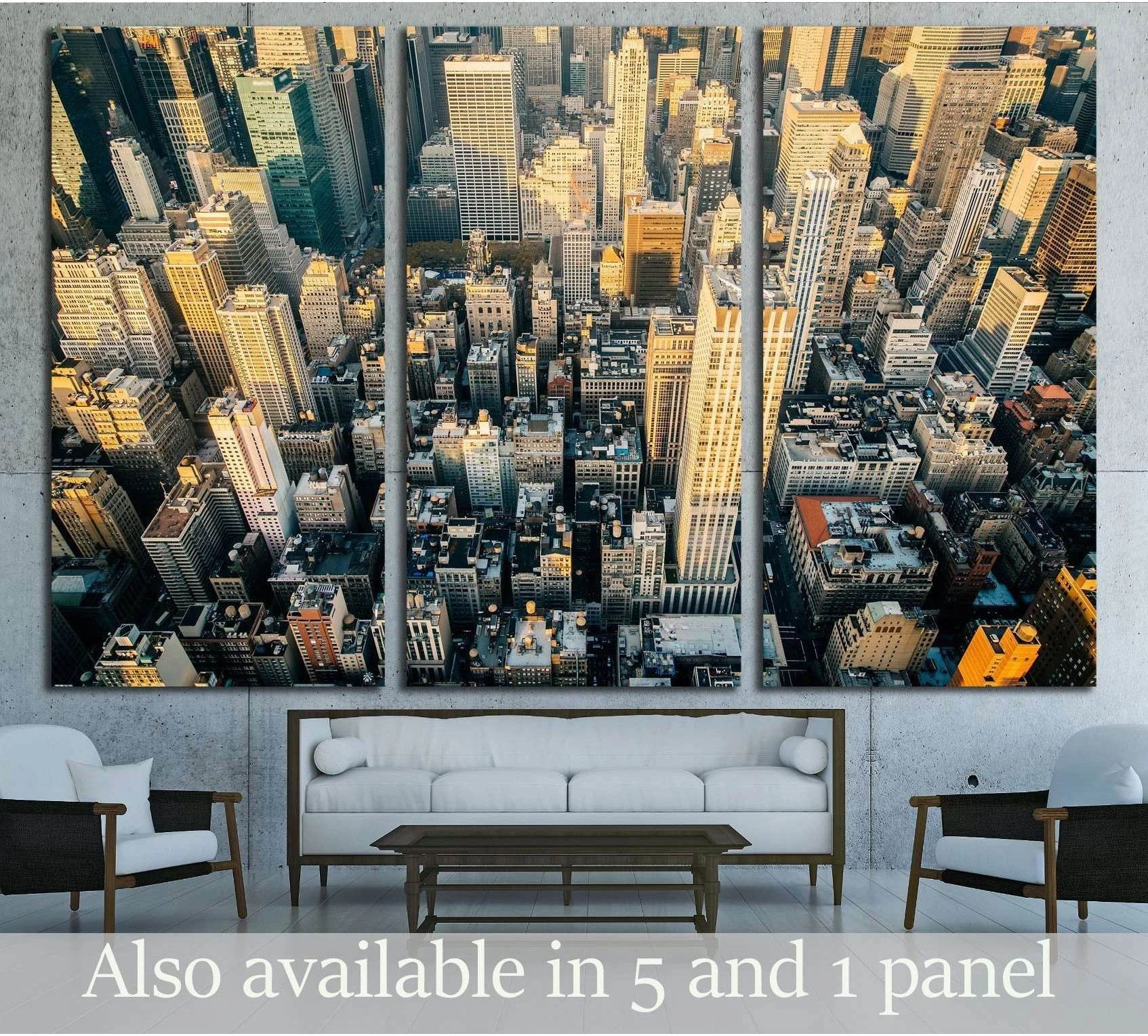 Aerial Midtown Manhattan skyline canvas print at sunset above sofa in modern living room