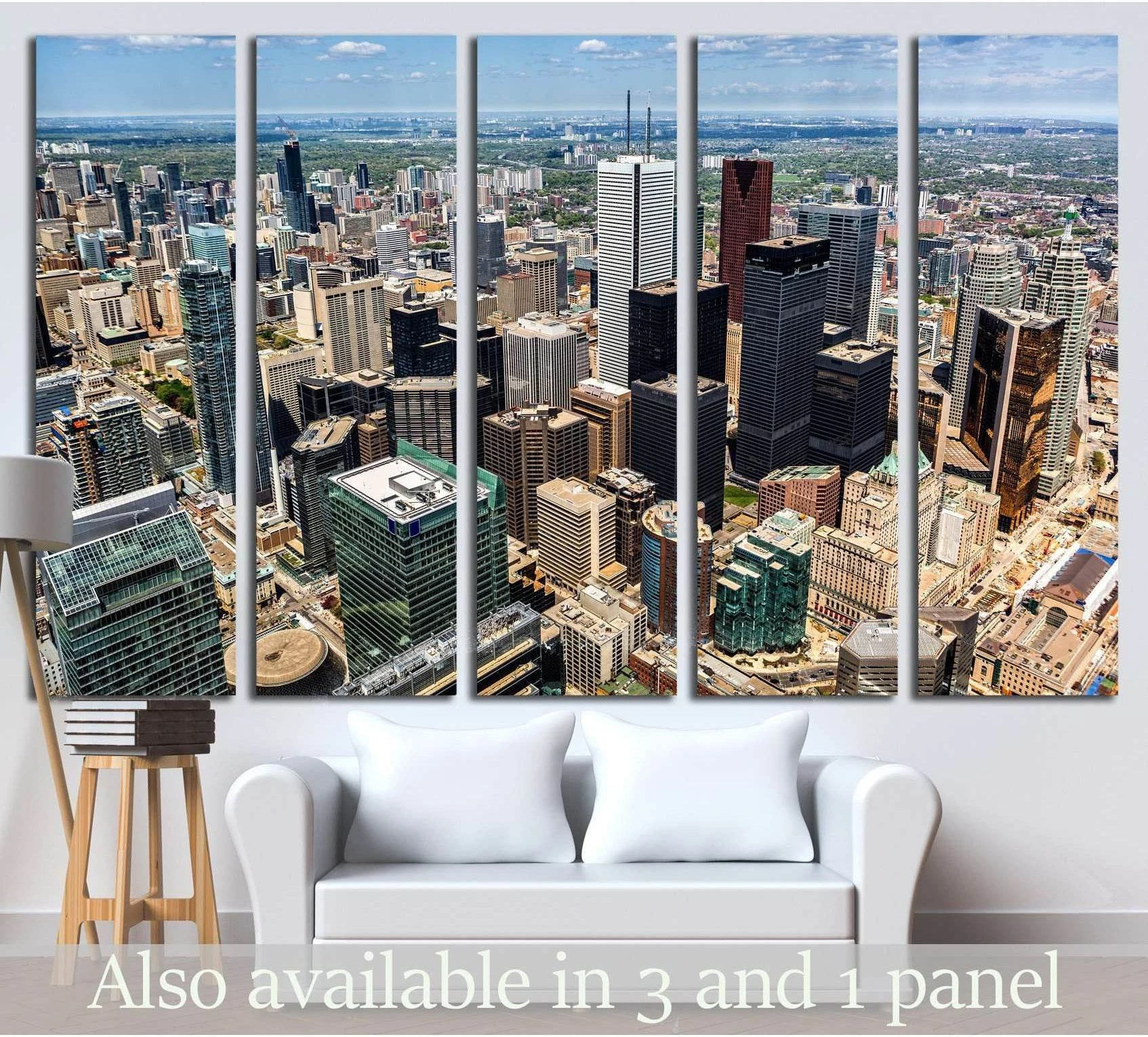 Aerial Toronto skyline canvas print with downtown high-rises and CN Tower above a white sofa