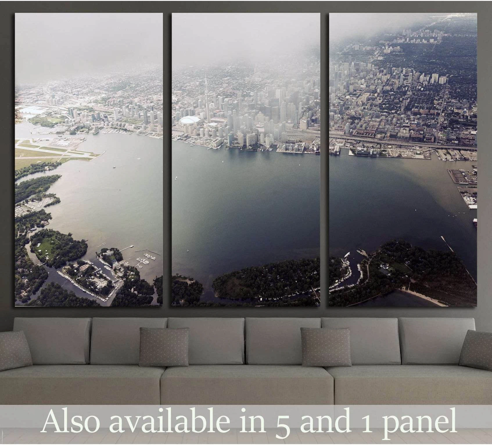 Toronto aerial triptych canvas print with skyline, waterfront, and islands above a sofa