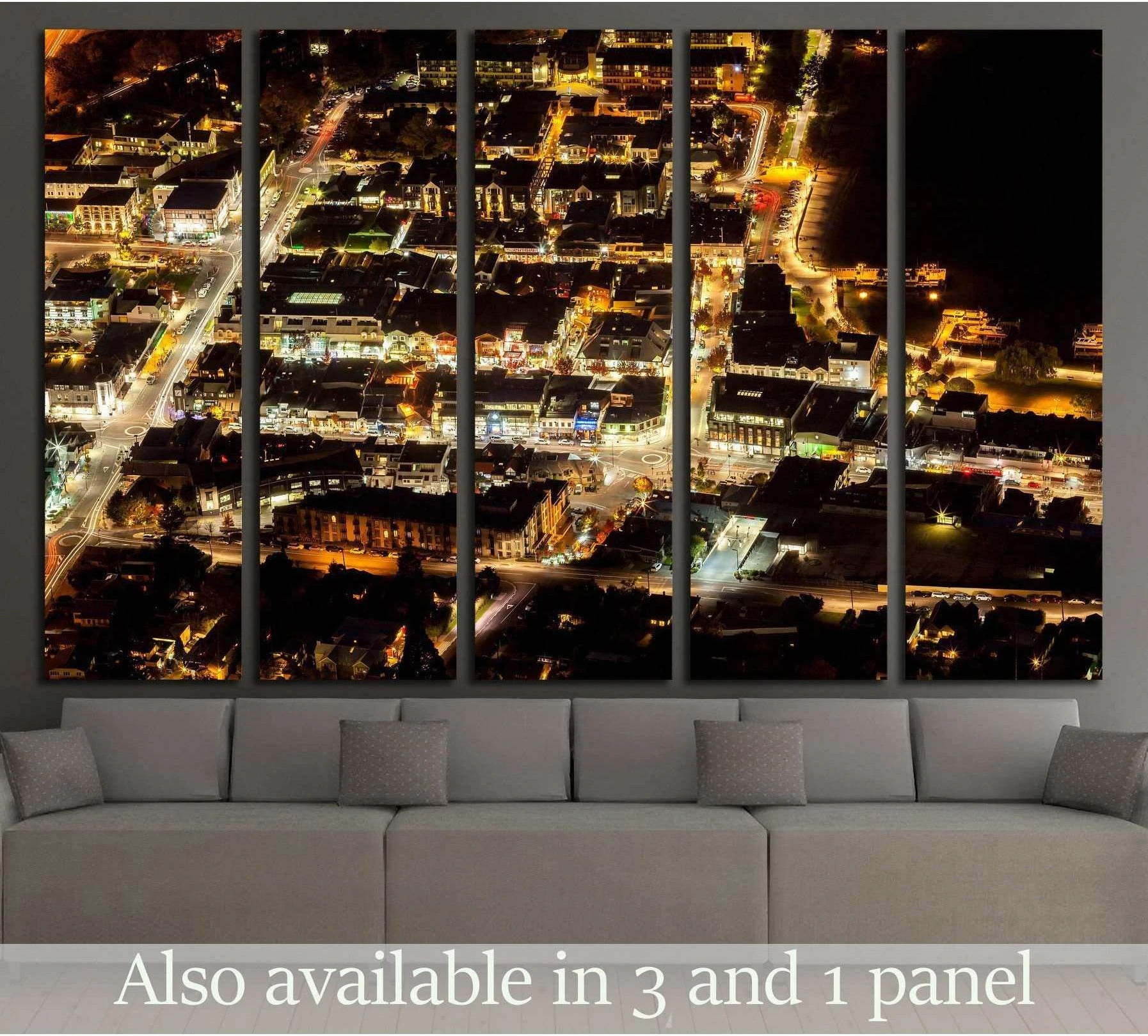 Queenstown New Zealand night aerial canvas print with glowing city light trails above a sofa