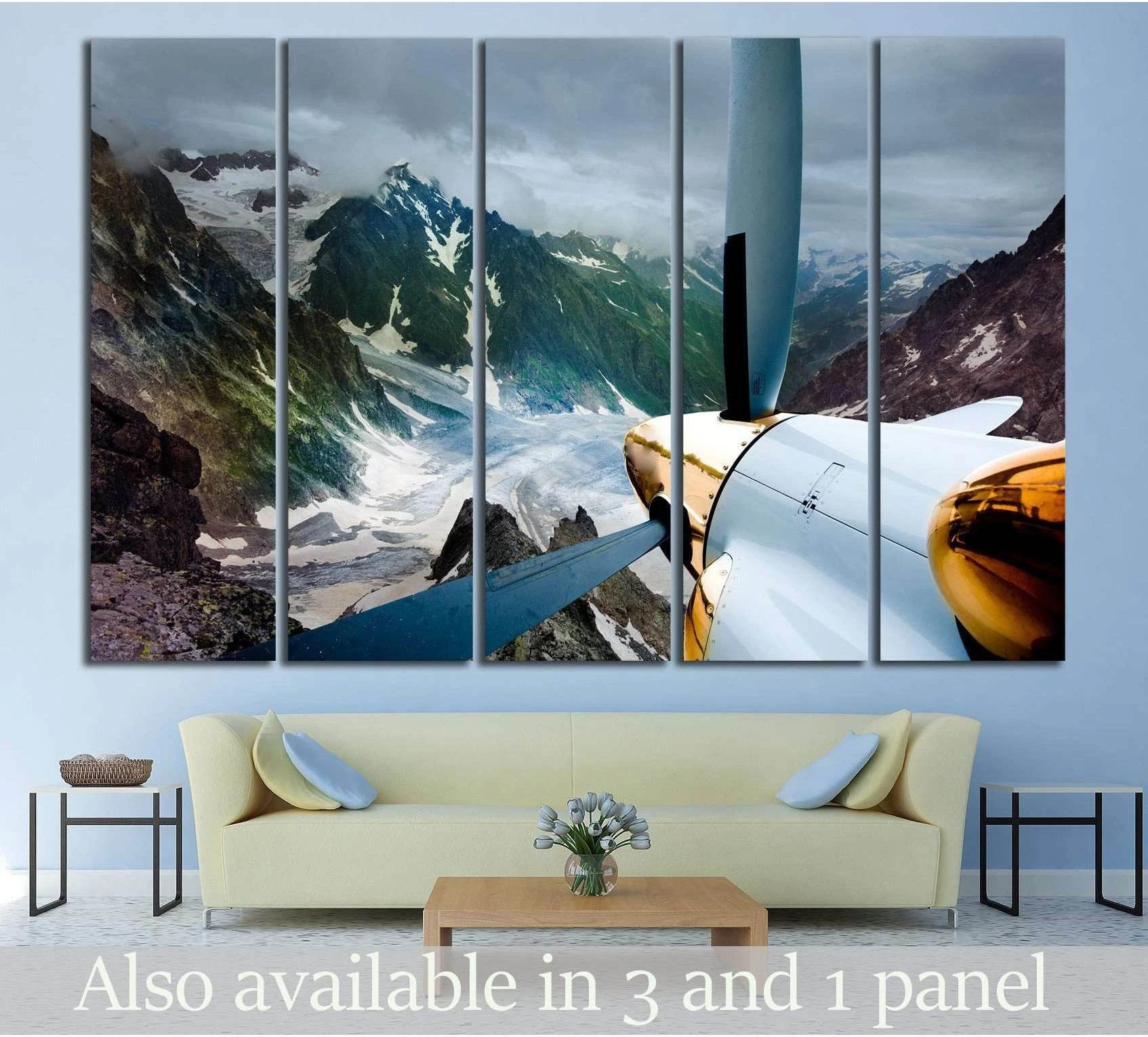 Airplane propeller canvas print over an alpine glacier valley, displayed above a sofa