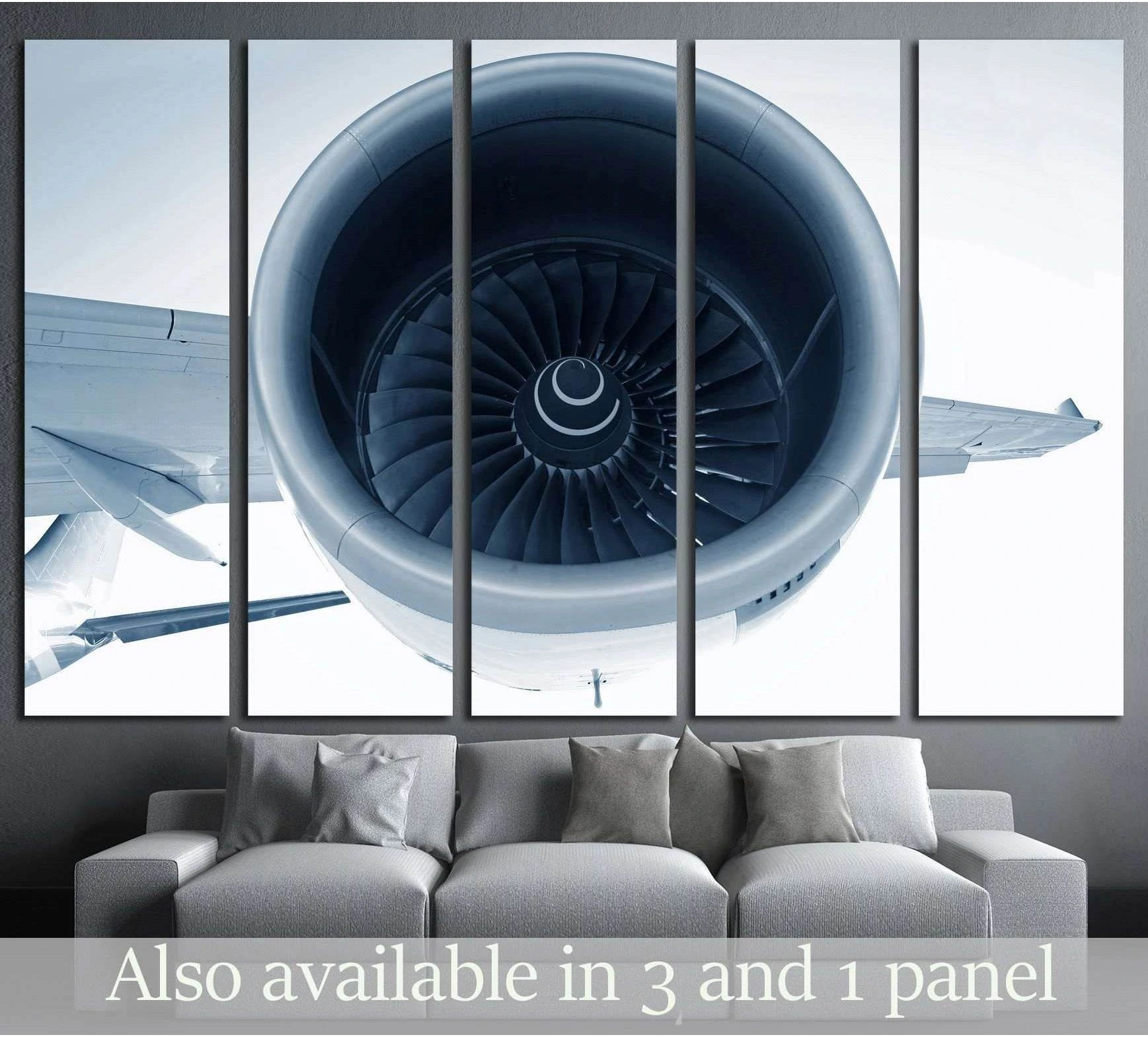 Front-facing turbofan jet engine canvas print hung above a sofa in a modern office-style room