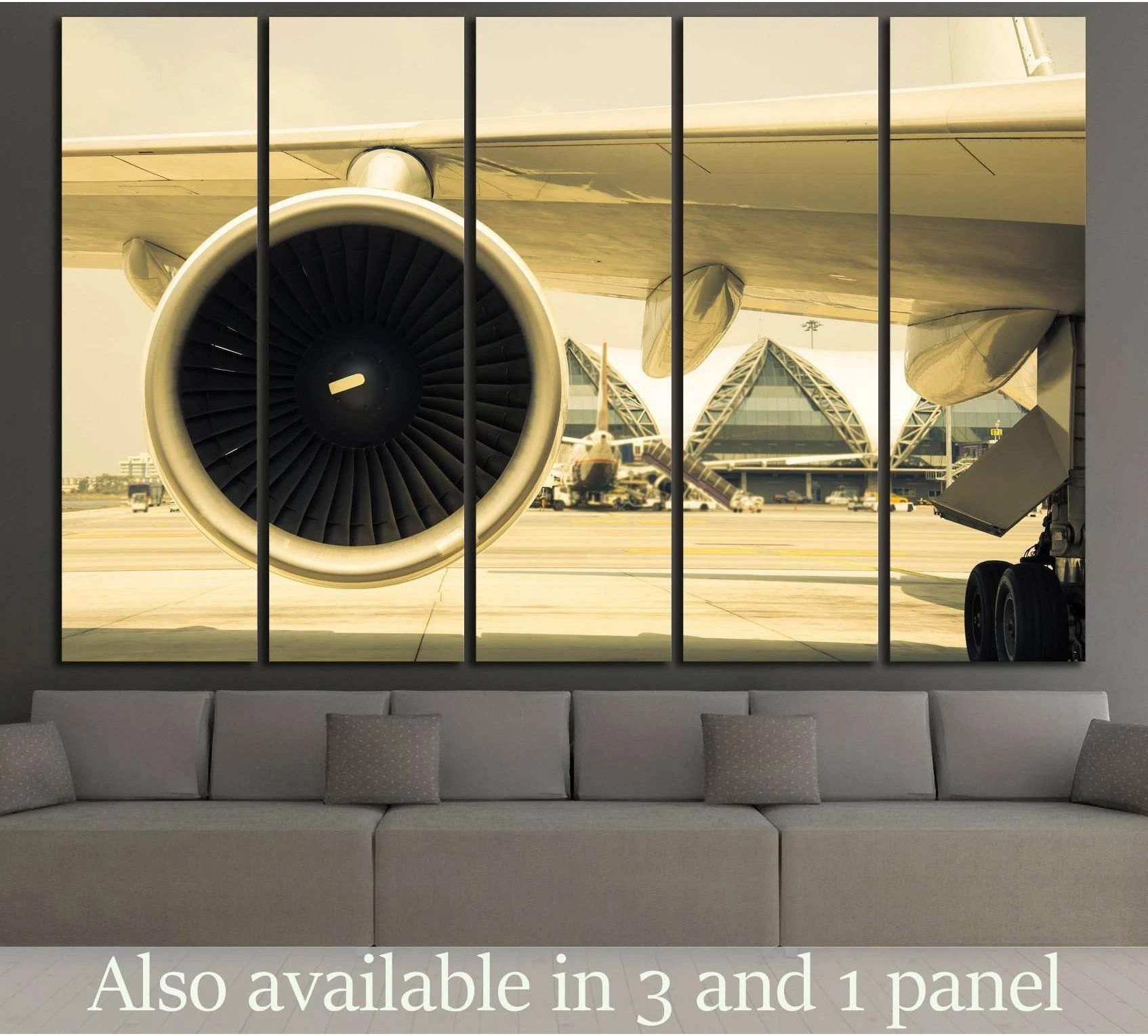 Sepia airplane turbine canvas print hung above sofa in a modern living room