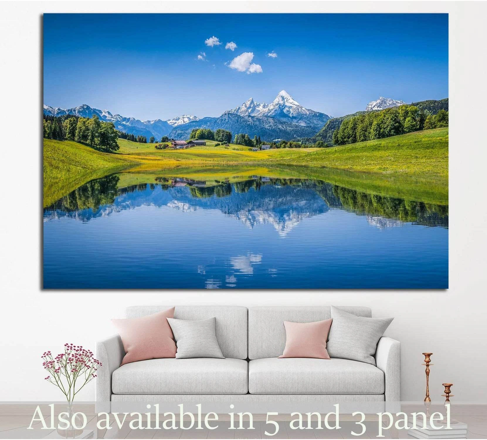 Alps mountain lake canvas print with snowy peaks reflected in clear blue water above a sofa