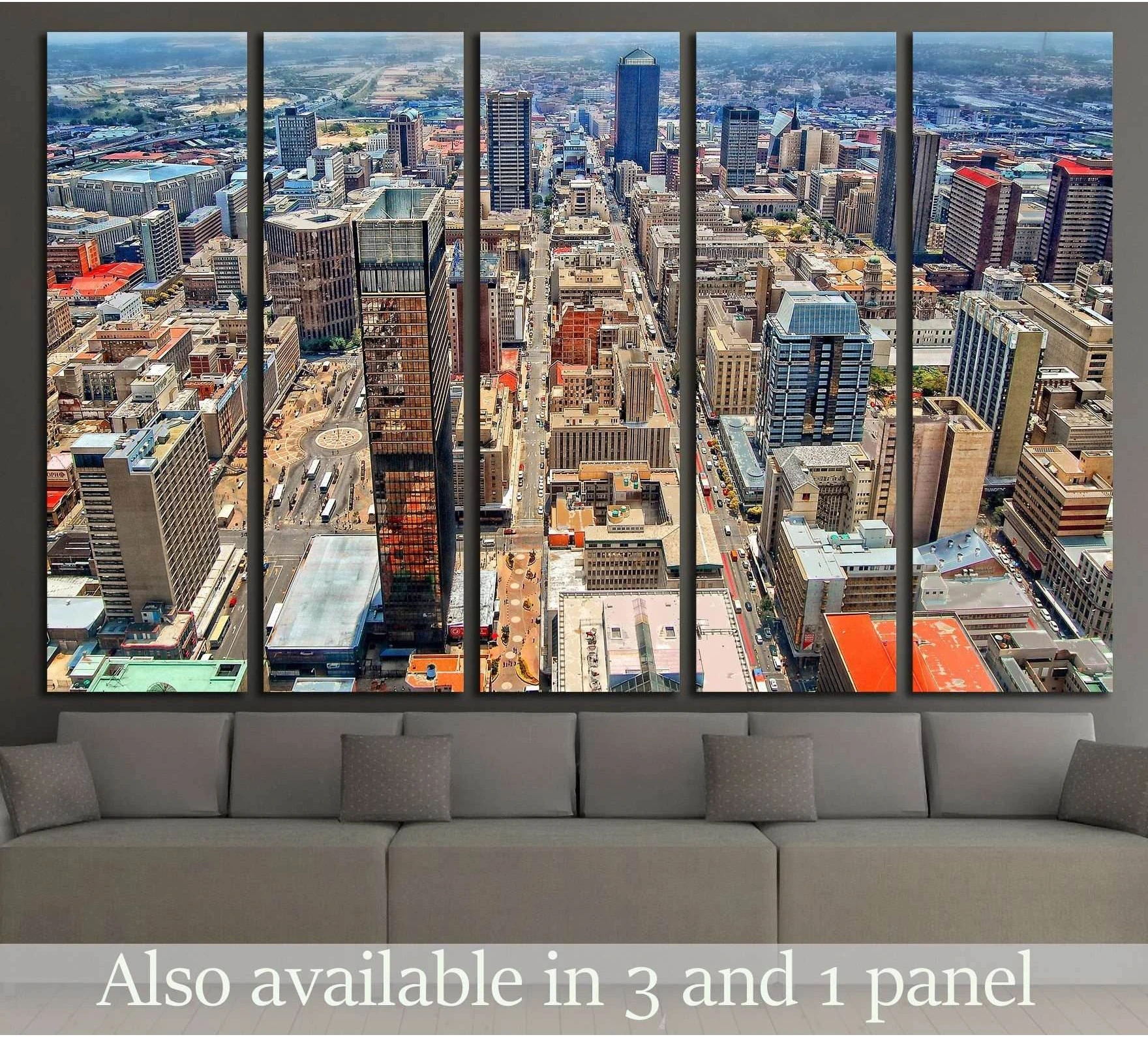 Johannesburg skyline canvas print with aerial downtown towers, displayed above a sofa in a modern living room