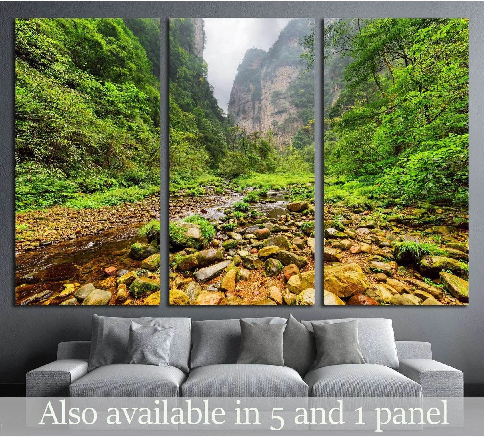 Zhangjiajie mountain river canvas print with rocky stream, lush green forest, and misty cliffs above a sofa