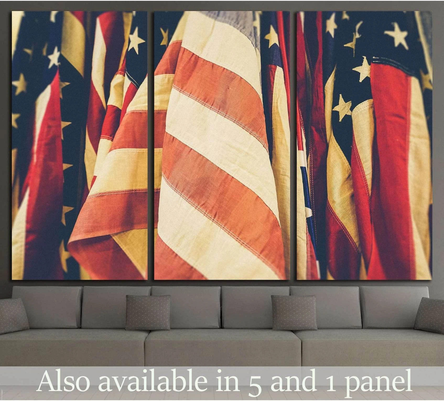 Close-up American flag triptych canvas print with vintage red, white, and blue folds above a gray sofa