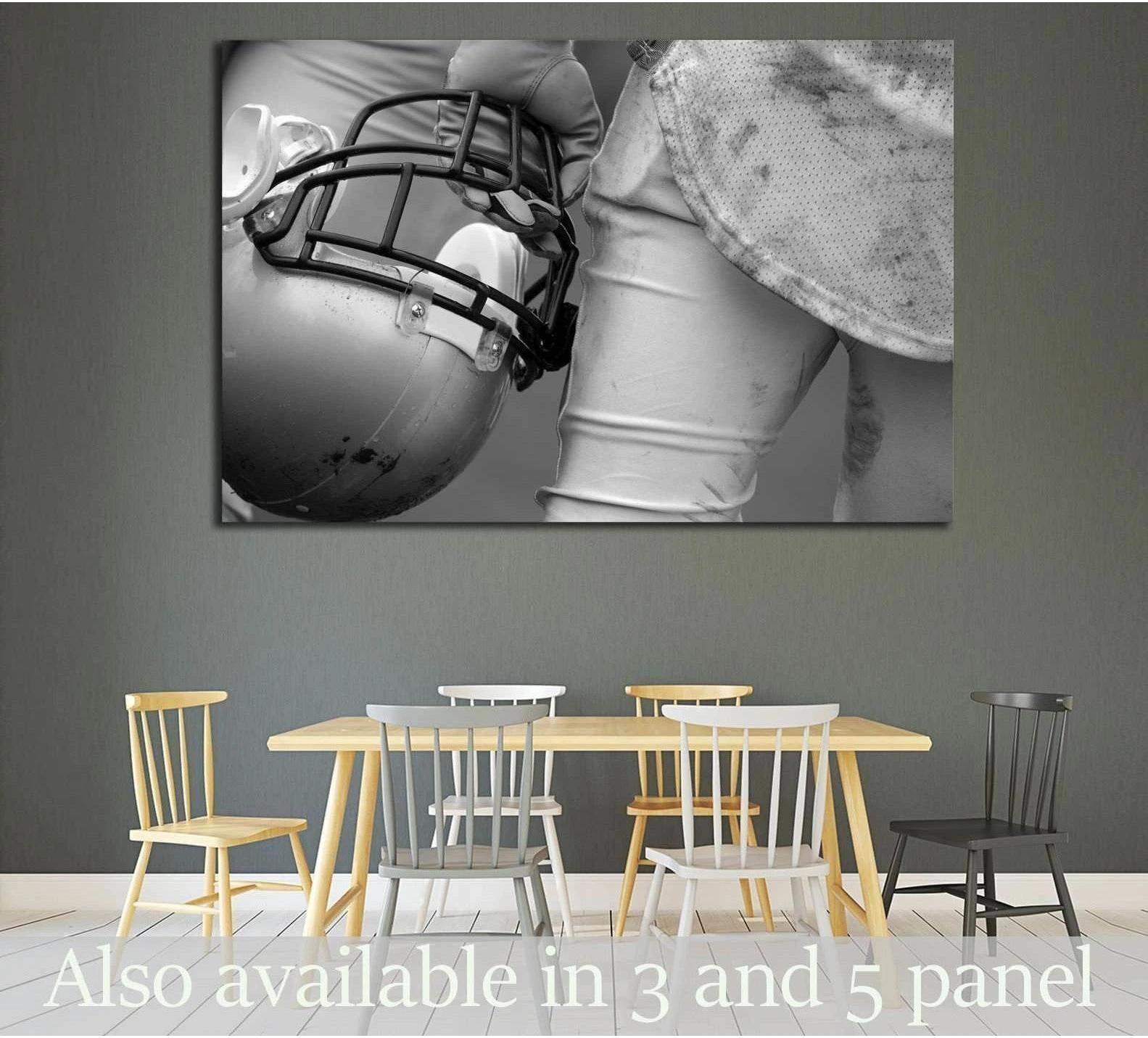 Black and white American football player canvas print holding a helmet, displayed above a dining table