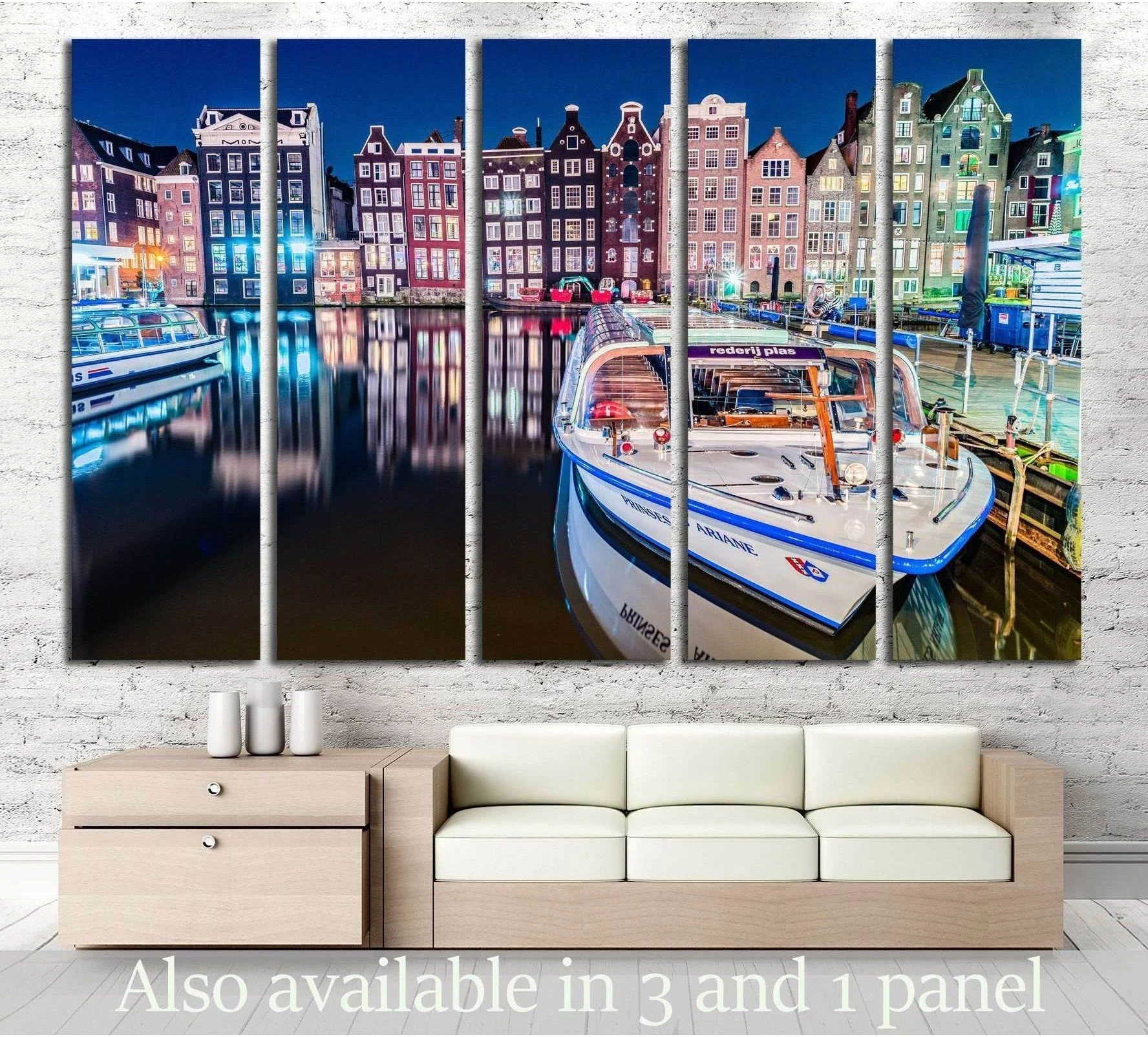Amsterdam Damrak canal boat canvas print displayed above sofa in a modern living room