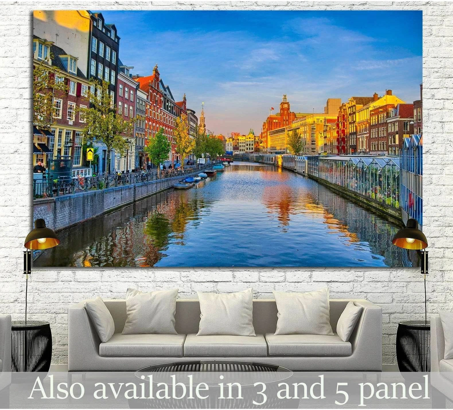 Amsterdam canal canvas print with colorful Dutch houses, blue sky, and water reflections above a sofa