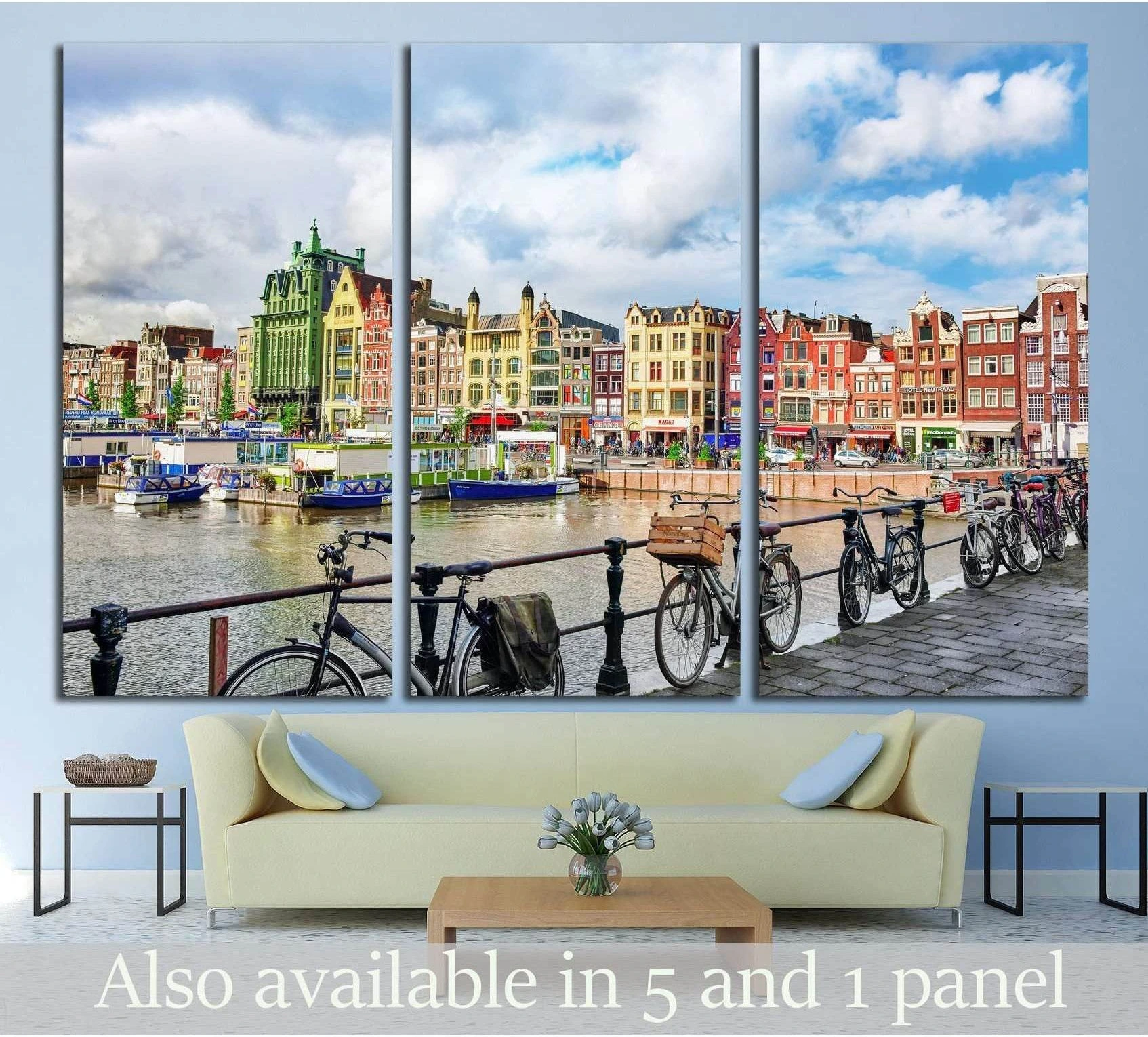 Amsterdam canal houses triptych canvas print with bicycles along the waterfront above a sofa