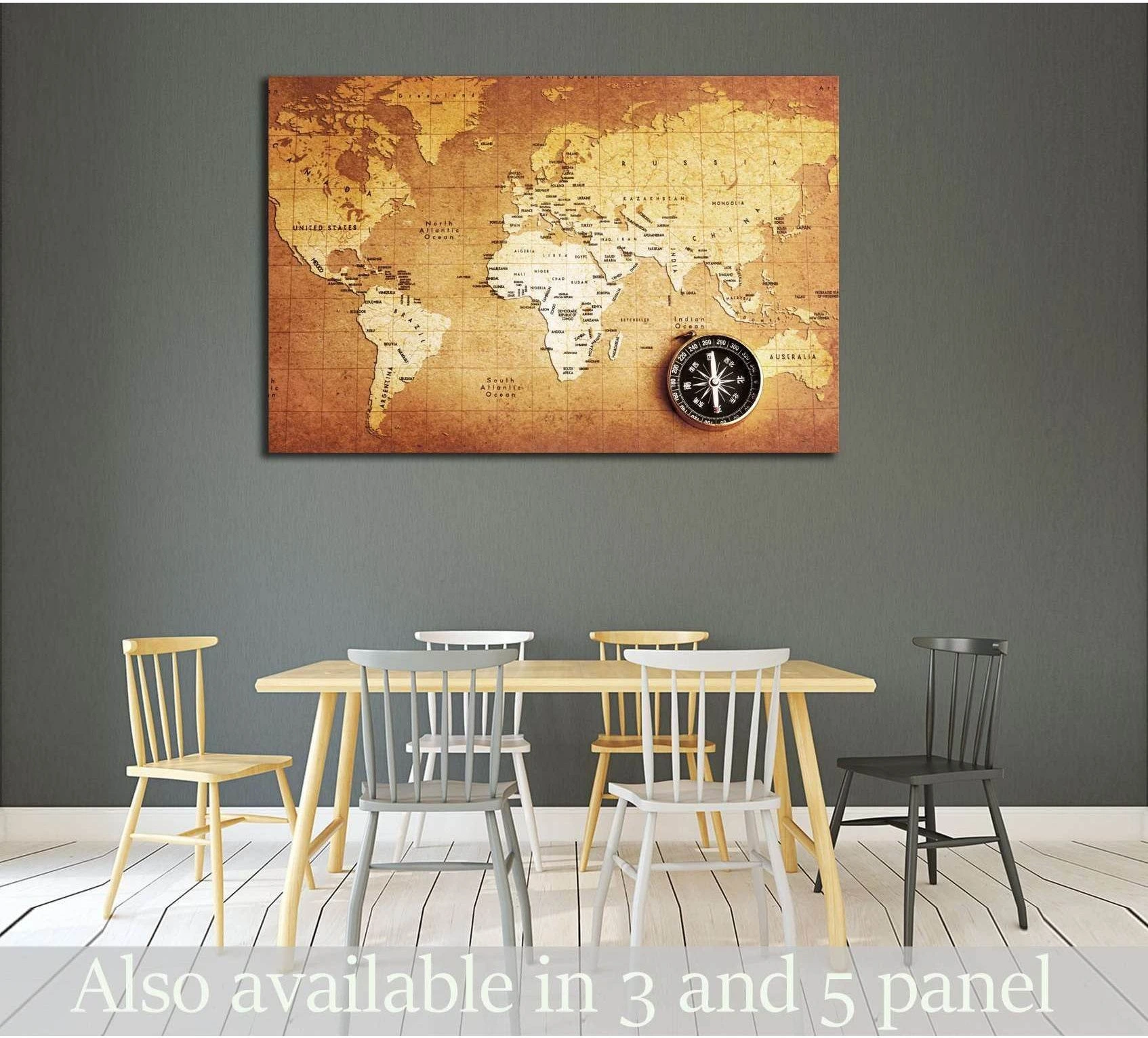 Vintage world map canvas print with brass compass hung above a dining table in a modern room