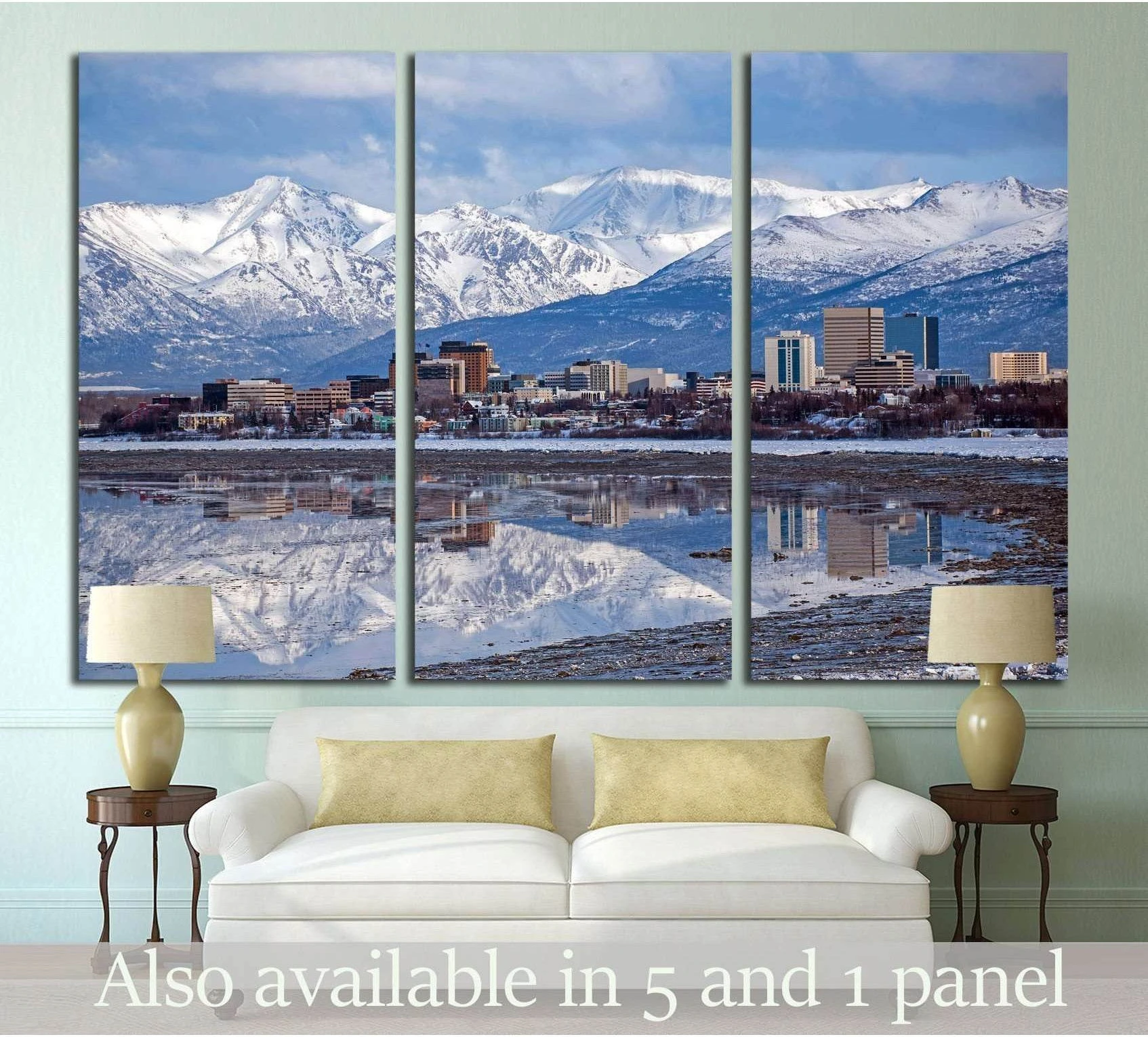 Anchorage skyline triptych canvas print with snowy mountains and city reflection above a sofa