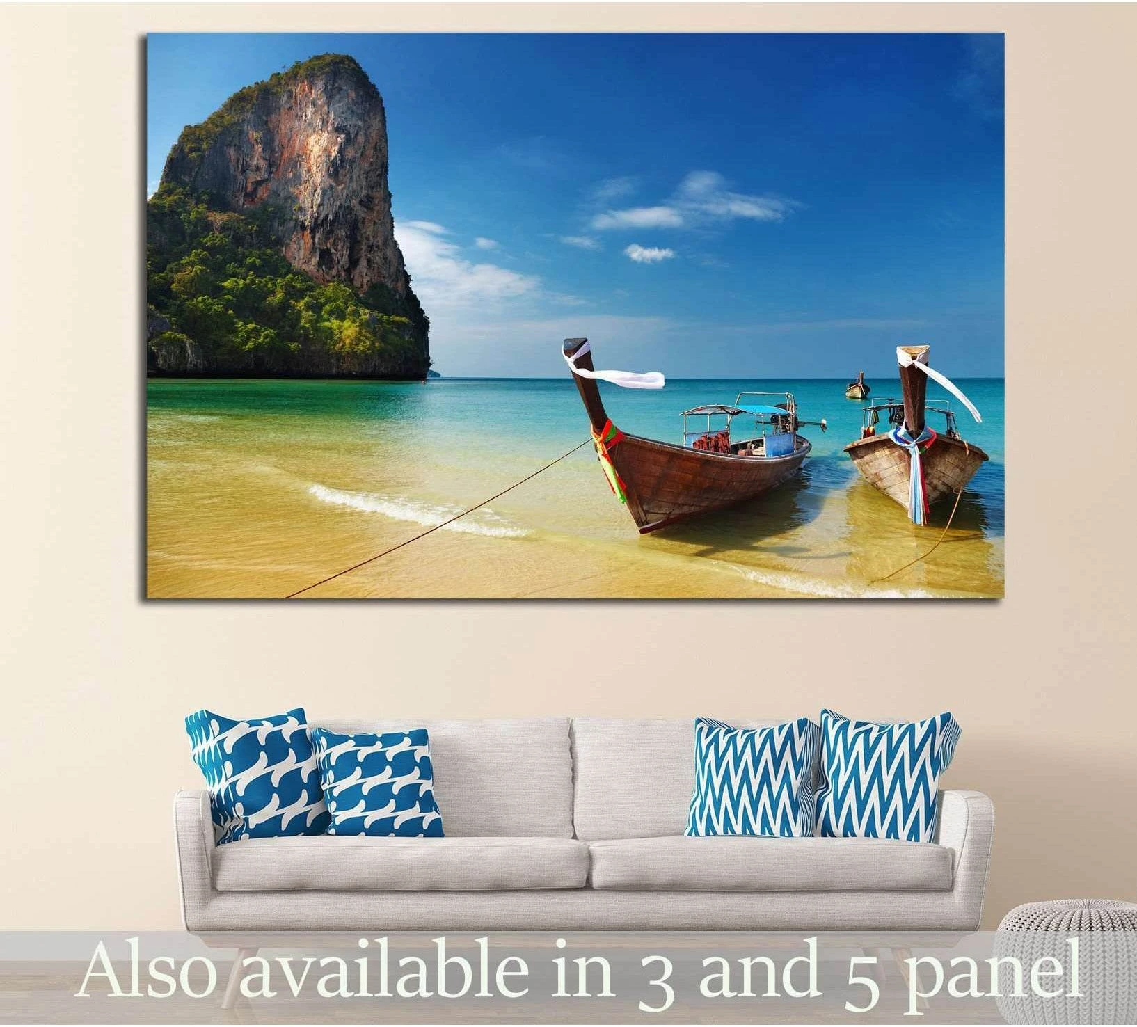 Thailand beach canvas print with two longtail boats on turquoise Andaman Sea water above a sofa in a coastal living room